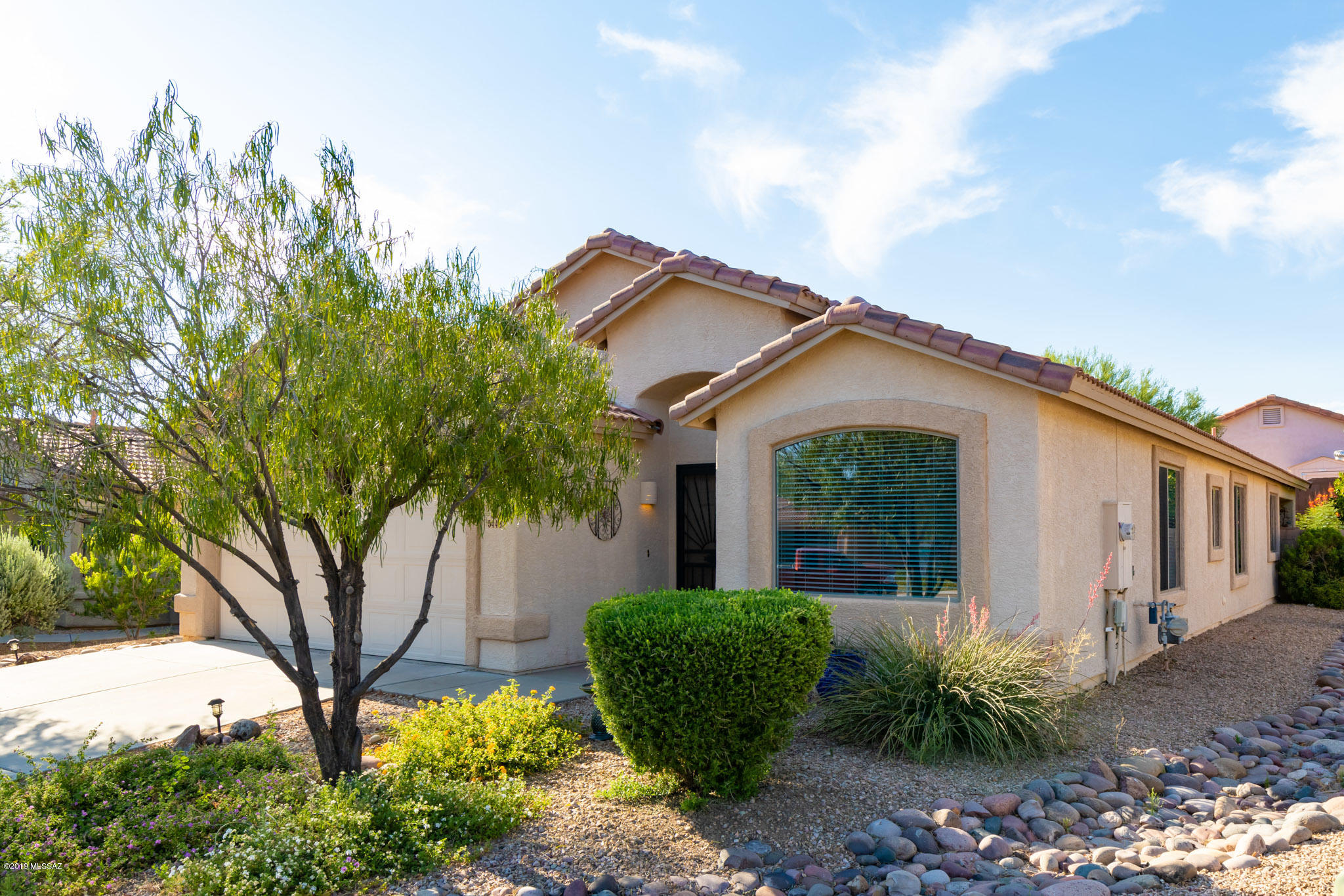 Immaculate Dove Mountain property in the Villages at Redhawk! Pride of ownership shows through in this home located in desirable Dove Mountain community. New HVAC installed spring 2019. This 4 bedroom 2 bath home features upgraded 18 inch porcelain tile. Stainless steel appliances and upgraded counter tops. Vaulted ceilings. Huge master bedroom and bath. 
Decorative touches throughout. Enjoy the relaxing yard with mature vegetation and extended patio. Short walk to community park with tennis courts, basketball and play area. Easy access to dining, shopping, Ritz Carlton resort and Marana Outlet mall. New Marana CSTEM school located minutes away. Contact listing agent for a showing today! Listing agent related to sellers.
