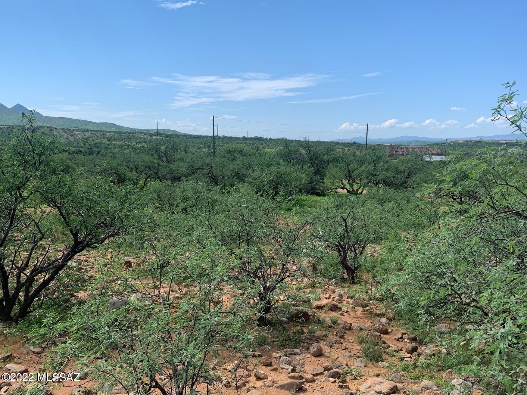 Nice flat easy to build on lot, all paved access.  Only about 6 minutes from I-19.  Electric and it appears water are at the street.  Water should be verified by the water co during inspections.