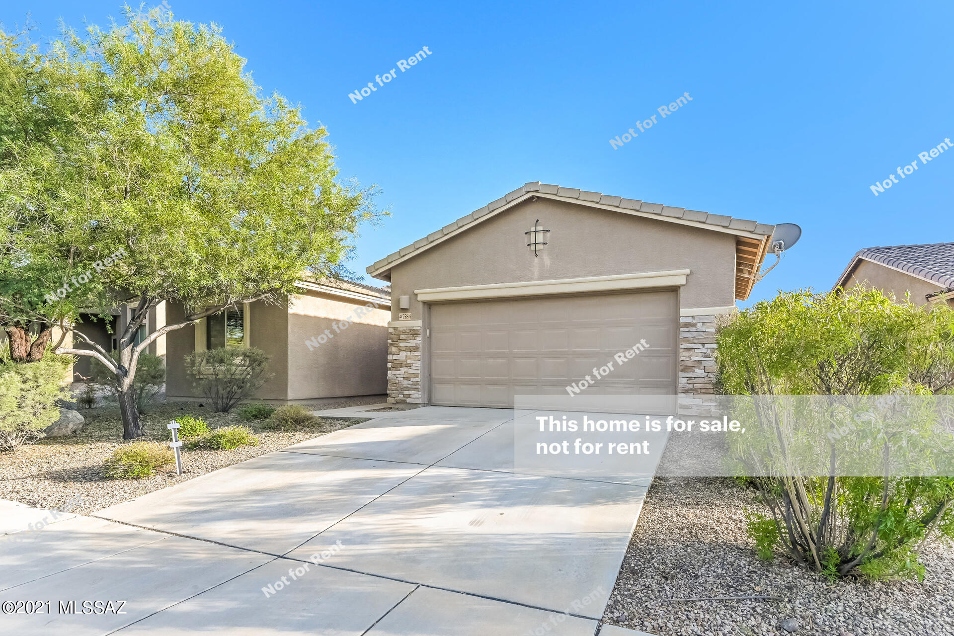 This Tucson one-story home offers a patio, granite countertops, and a two-car garage.