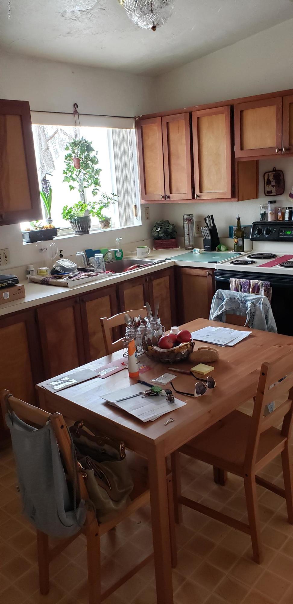 Perfectly located in The expanding University rental Area. Large Covered Patios, Walled in Back yard with Laundry room. Mature Plantings. With Minimal property Improvement, Unit Rents could be higher based on Comps