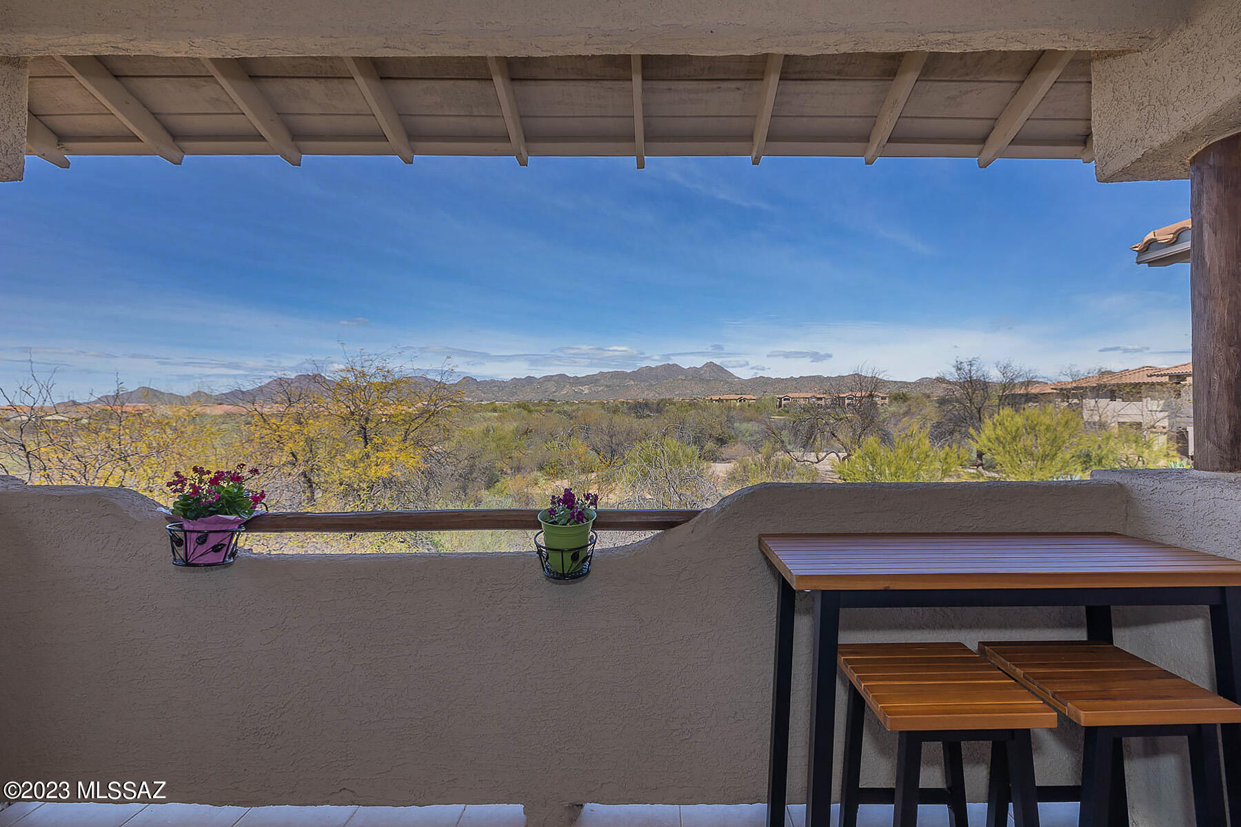 Exceptional corner unit with garage boasts panoramic mountain views from upper level. This stylish 1,240 sq ft luxury condo offers two en-suite bedrooms plus open concept floor plan. Living area is highlighted by a media wall, separate dining area and sleek new chef's kitchen with breakfast bar, granite counters and stainless appliances. Newer paint, carpet, windows, appliances, HVAC, water heater and more. Primary bedroom has walk-in closet; built-in desk in guest room. Laundry closet in unit plus private balcony overlooking nature preserve. Fabulous community center with exercise room, outdoor pool, spa, firepit patio, ramada & dual BBQ's. HOA includes water/sewer/basic cable/exterior maintenance of grounds, building, roof & pest control. Perfect for year round or seasonal enjoyment.