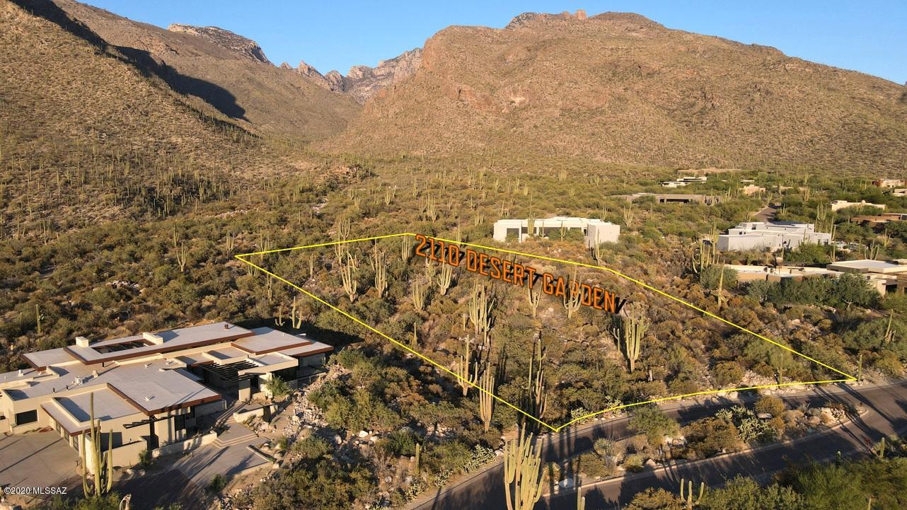 Spectacular canyon, mountain, sunset & city views from this incredible parcel in the exclusive and highly coveted gated community of Pima Canyon.  Pristine, gently sloping lot with lush vegetation including majestic saguaros and beautiful desert terrain.   Close to high end shopping and dining.  Easy build for your luxury dream home.