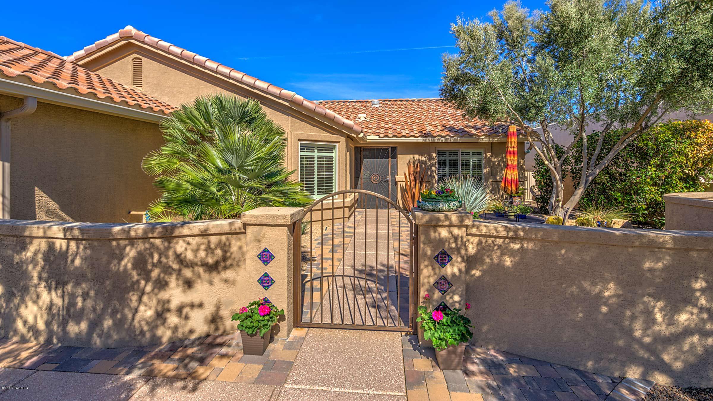 The park like setting of this highly upgraded Laredo awaits. The private entry patio is the perfect spot to enjoy the mountain views. The great room is inviting w/warm wood floors, a wall of windows overlooking the beautiful, private backyard. Kitchen features granite counters, high-end stainless appliances including gas range, and handy center island. The eating area w/wrap-around windows highlights the entry patio w/the mountain views beyond. Spacious master w/bay windows, en-suite w/double vanity, shower & walk-in closet. Guest bedroom w/bay window. Convenient den & guest bath. Plantation shutters throughout this beautiful home plus extended garage. The private backyard is ideal for entertaining w/built-in BBQ w/sweeping counters on both sides, plenty of hardscape & mature landscaping.