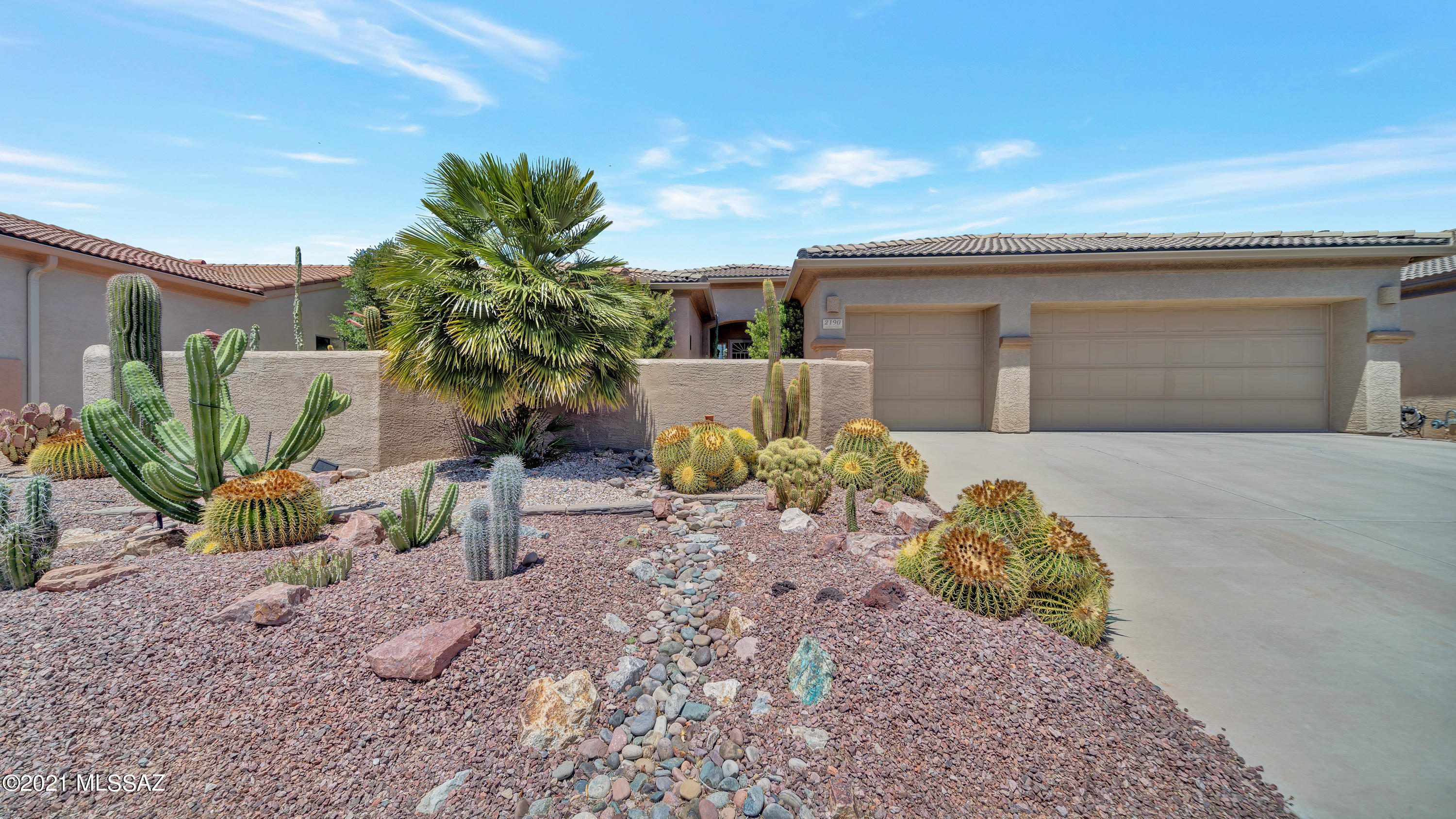 As you walk into the courtyard of this home you immediately think southwestern elegance at it's finest!  This is not any normal Arlington model floor plan since it truly demonstrates charm and beauty boasting southwestern paint colors, a high end kitchen and an inviting backyard patio.  The gourmet kitchen was remodeled in 2019 with granite countertops, rustic alder cabinets and slate stainless steel appliances with a gas stove and two drawer oven.   The kitchen opens up to the comfortable great room with a bee hive fireplace and looks out to a covered patio which would be perfect for entertaining.  The built in barbeque and fire pit encourage back yard gatherings while enjoying the desert beauty below.  The owners of this home have meticulously maintained it while enhancing it with a "one of a kind" charm.  Call for your showing today as it won't last long!