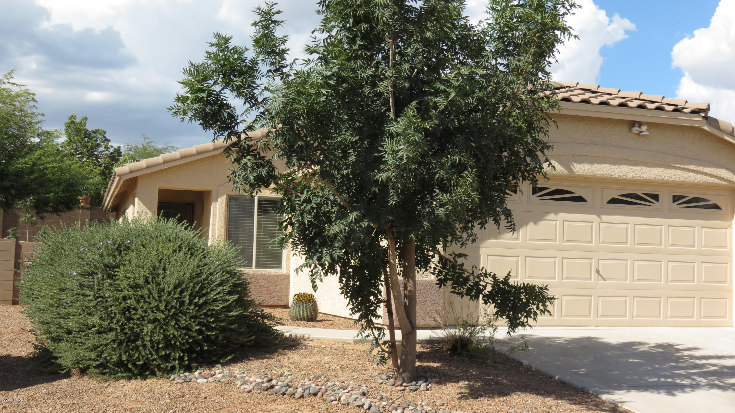 Everything is new! Great property on a premium lot with privacy and view of the Catalina Mountains. Fresh paint inside and out all new tile including bathroom remodel, new fixtures, stainless appliances, butcher block island, and 3 inch blinds. Move-in ready in a quiet community with nearby park. Close to all amenities including library, shopping, and YMCA.