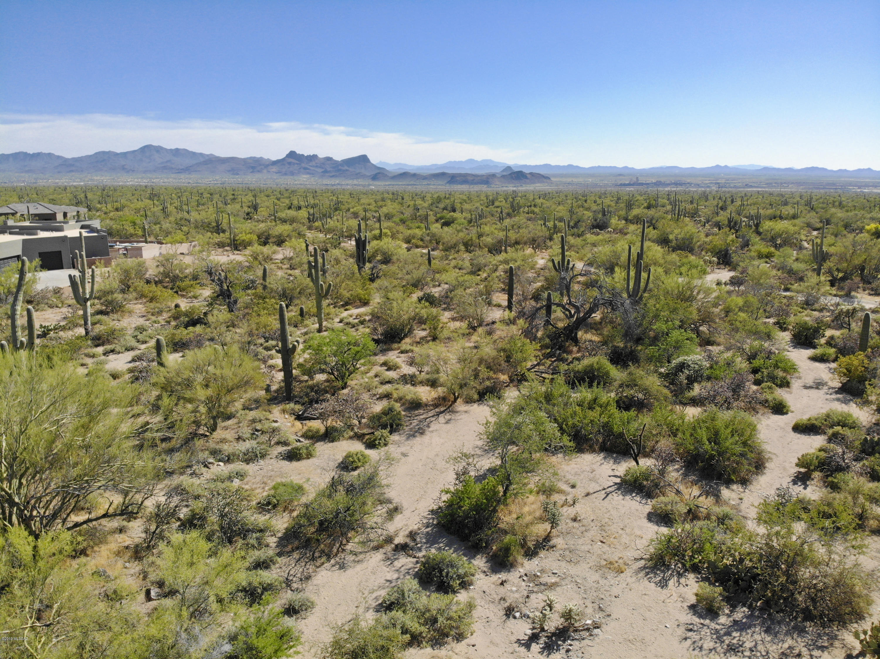 Extremely PRIVATE custom homesite of 2.50 acres in the Estates at Tortolita Preserve with multiple mountain & open desert views. This spacious lot features extraordinary saguaros and is adjacent to the Tortolita Preserve, a 2,400 acre open space immediately to the west. Those looking for privacy will also appreciate the cul-de-sac location. Relatively flat site allows for lower site preparation costs. This community is ideally sited for those seeking an active lifestyle with neighboring hiking/biking trails and exceptional golf, restaurants and other amenities nearby. Buy the lot & build your own custom home design or build one of premier local builder John Herders plans which you can customize. Visit the Tortolita Preserve website today for more information. Contact listing agent to view.