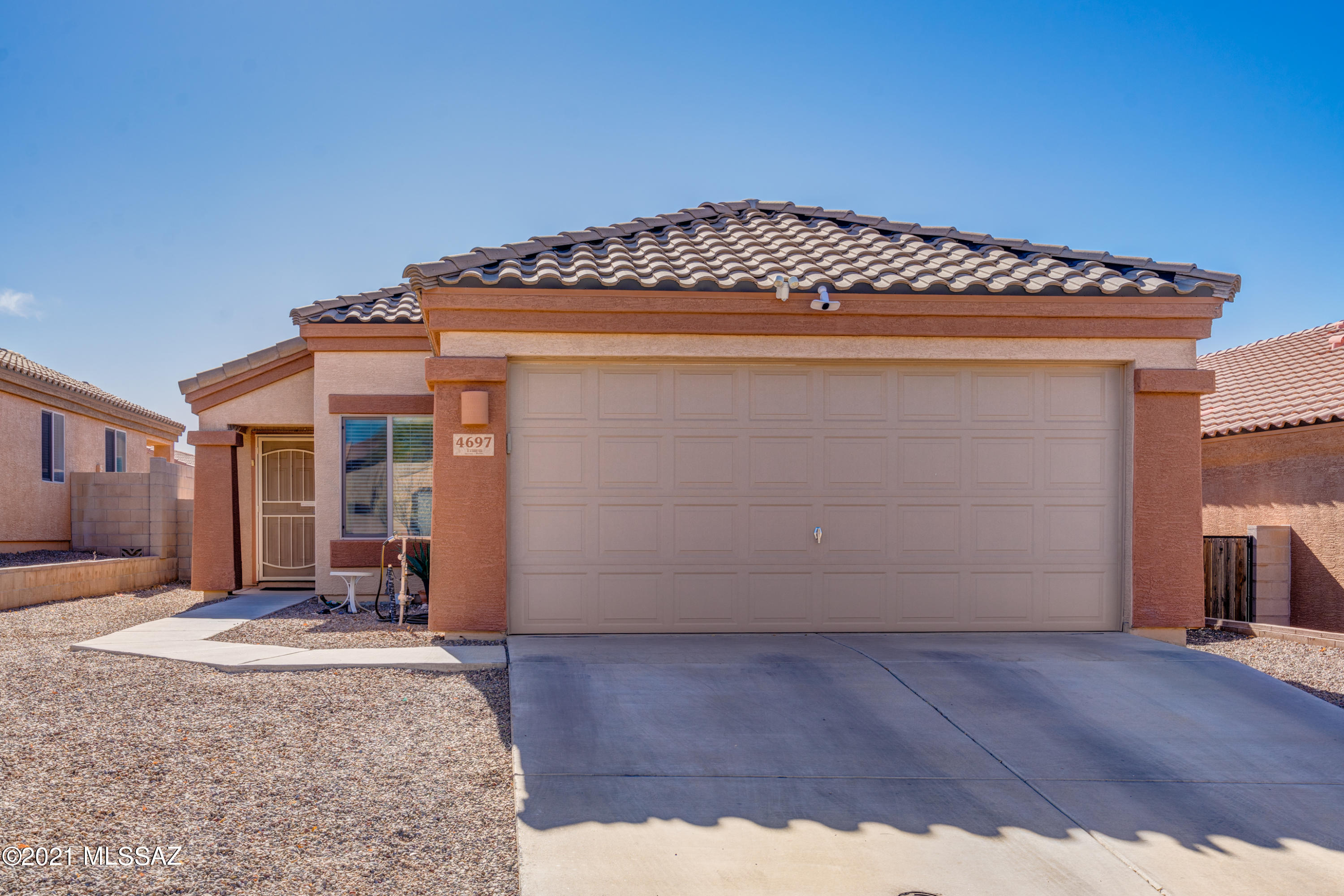 WOW - $215,000!  Awesome 3-bedroom/2-bathroom family home on a quiet street, in a perfect Pima Farms location, near everything (parks, walking trails cafes, etc.) and two-minute access to I-10. Huge, fenced backyard with a view of the mountains and custom, walled-in dog run area.  2-car garage. Absolutely the best deal for the money in Tucson.