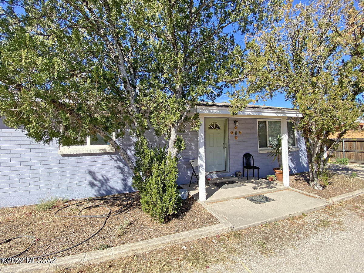 Charming Central Compound Known As Bellevue Hideaway. 8 Units tucked off main street. Sits on 1/2 an acre.This Unique Special property is private and has been well cared for.Two one bedrooms and two 2 bedrooms are Stand Alone Units. Other 4-plex is 3 one bedrooms and a studio upstairs. All have AC units have W/D  hook ups except Studio. All units have yards. Only Water is on one meter all others separate.
