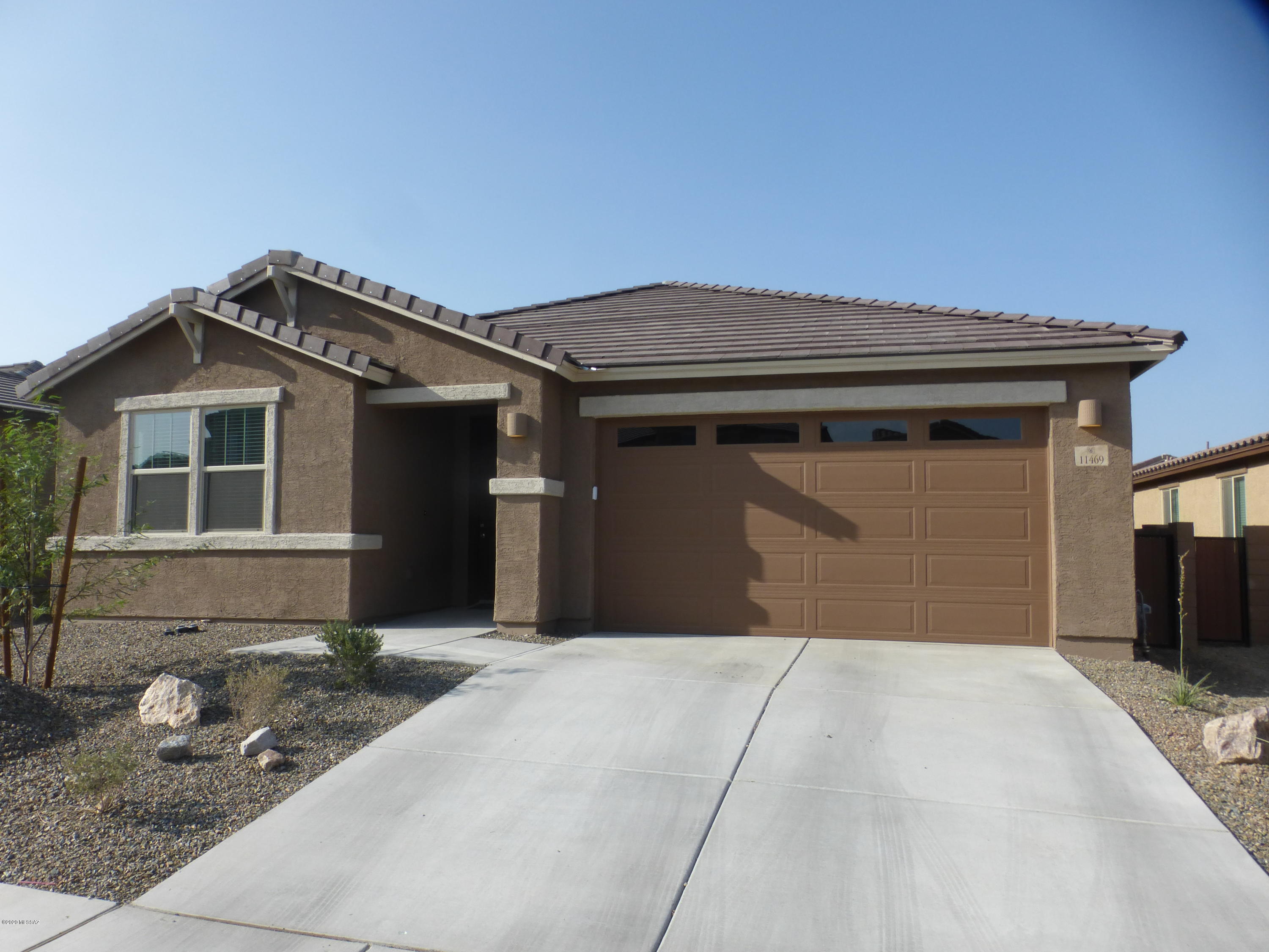 Wonderful 9 month old home move in ready with over $20,000 in upgrades from the design center!  4 bedrooms, 2 baths with 12X24 tiles in living areas.  Other upgrades include quartz countertops throughout, custom tile master shower, water softener, side garage door, custom cabinets, double door to den, ceiling fans as well as gas stub out and graveled low care backyard.  This home is not to miss as it's clean and still in the 12 month builder warranty period also has other warranties that possibly transfer...  easy show!  Of course it's in the Vail School District and close to major shopping and services about 2 miles away on Mary Ann Cleveland and Houghton.  Not to mention The LOOP bicycle trail can be picked up close by at the Houghton Bridge!!