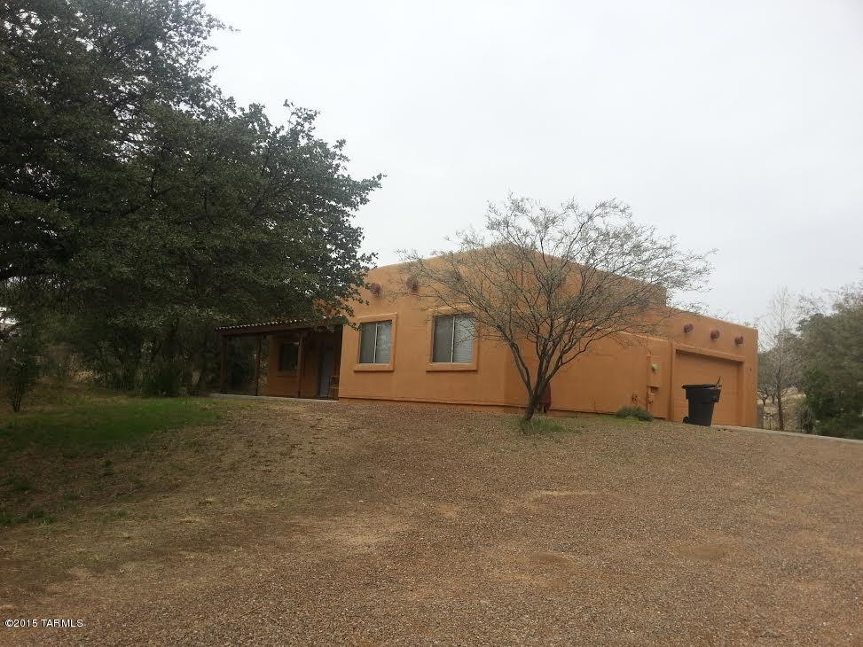 Lovely Sante Fe style home in excellent condition. Rental includes a family room with built in entertainment center, two bathrooms, modern appliances, ceiling fans in bedrooms, new carpet, ceramic tile. Don't miss out on this well cared property. Tenant pays sewer. Please text 520-490-5232 with address and your email for application and deposit info.