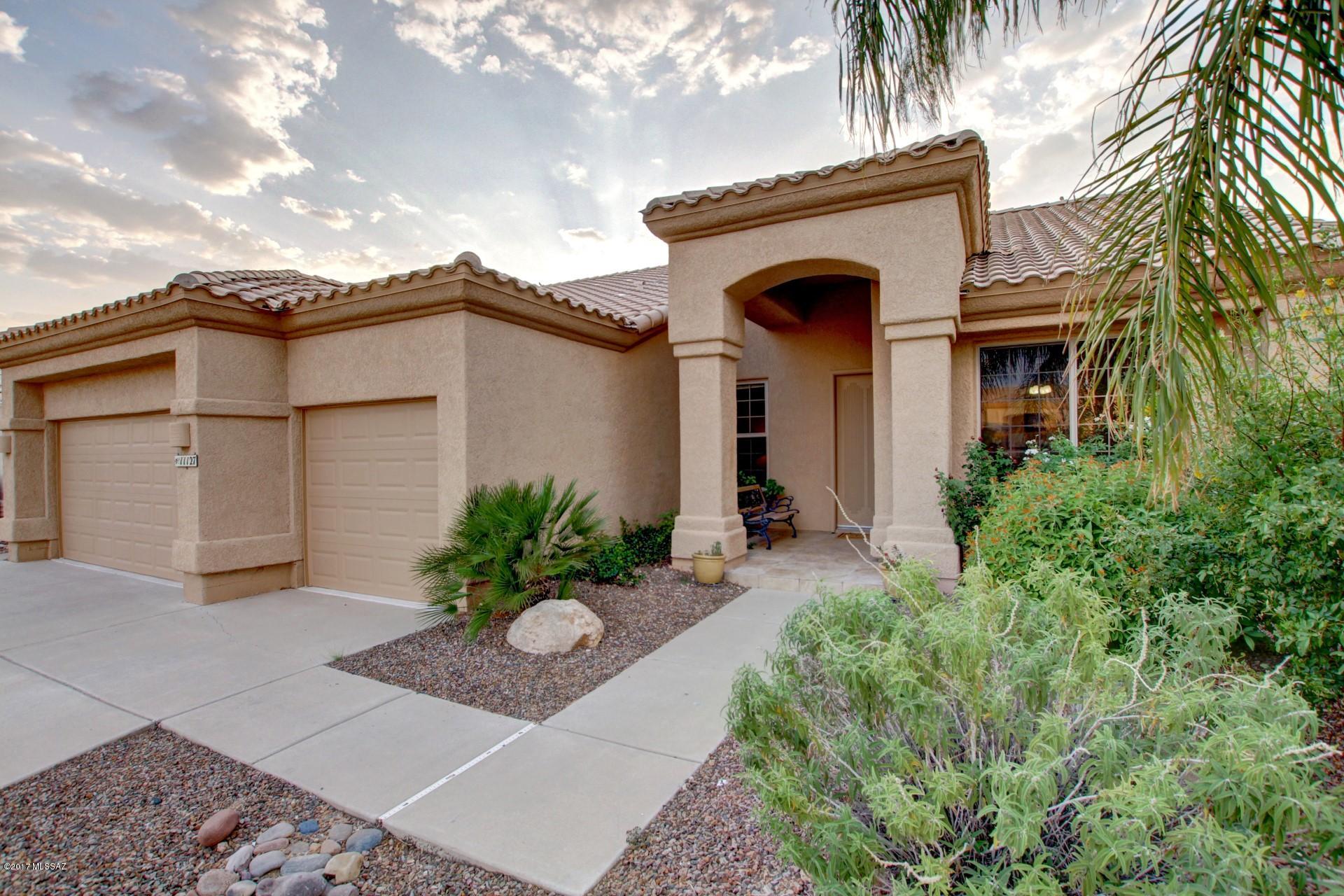 Gorgeous Coscan-Built (not KB) home with great curb appeal priced below comps for quick sale! Nestled on a view lot with mountain and natural desert Views, this model perfect home offers open floor plan, soothing palette of new paint, new plush carpet, new garage doors, new stone water wall, new screens, newly serviced roof and termites, new drip lines and more. Chef's kitchen features center island, breakfast bar, newer SS appliances, bay window, patio access, and plethora of wood cabinetry. Master retreat with high ceiling, patio access, walk-in closet, and spa-like en suite. Generous size bedrooms, ample closets, and upscale baths. Enjoy the backyard covered tiled patio, meticulous desert landscape, grassy play area, & breathtaking views. Seller is licensed to sell Real Estate in AZ.