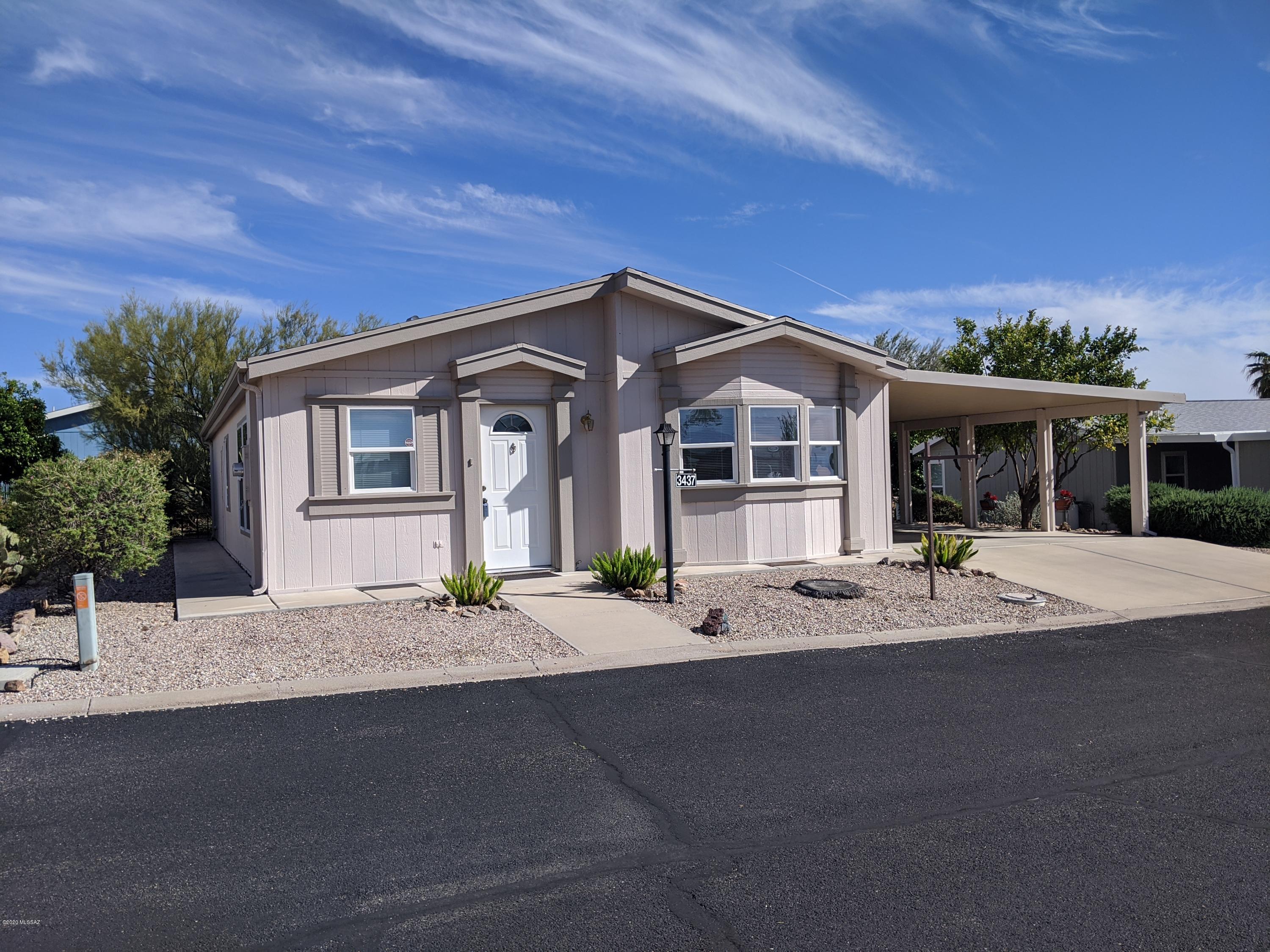 This move-in-ready Hallmark home is located on a quiet street with a private backyard. This 2BR, 2BA home includes nice laminate flooring, an open and bright living room, oak cabinets, newer appliances, dining area, Arizona room, extra storage, and a laundry room with utility sink. New roof in 2016, new A/C in 2017, dual-carport, fruit trees, and more! Copper Crest is a 55+ active adult gated community and offers many amenities: Jr.-Olympic-sized pool, spa, and clubhouse for many activities, including crafts and quilting, a workout facility, yoga, library, and game room. Other activities include Bocce Ball, a shuffle board, and Copper Crest hiking group. Low HOA fees!