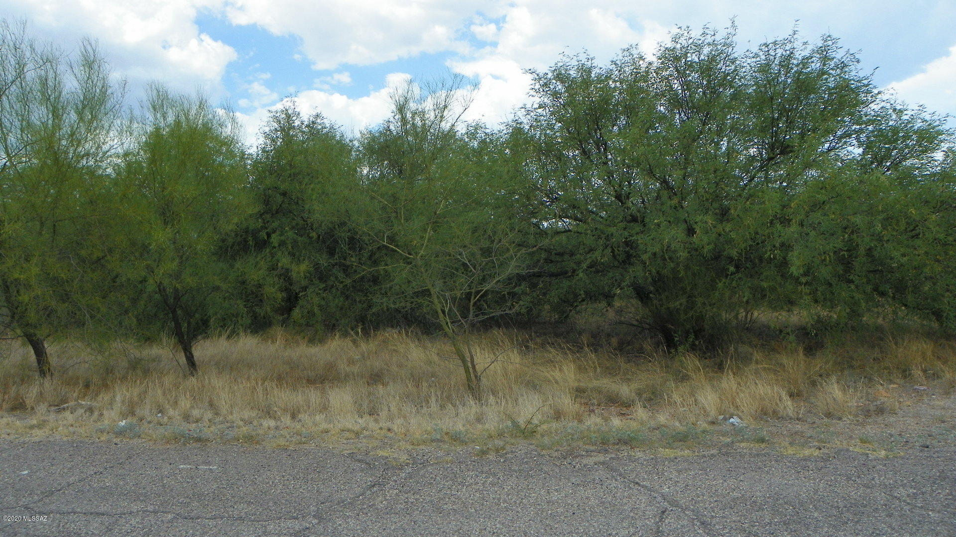 Flat residential lot.  Both electric and water appear to be at the street, water should be verified.  Paved road and only 5 minutes to the Palo Parado exit.