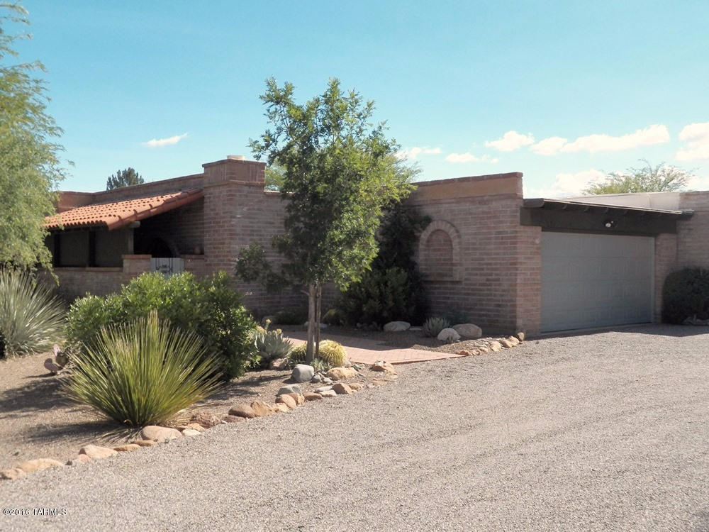 Old World Charm of a 2BR 2BA adobe home with a spacious 450sf 1BR 1BA casita. Enter the casita from a beautifully landscaped rear patio offering spectacular, unobstructed Santa Rita mtn and Elephant Head views amidst complete privacy. The ¾ acre lot has a rural wooded setting. The kitchen opens to the living/dining area where the gas beehive fireplace is the focal point. The master bedroom suite consists of a huge walk-in closet, walk-in shower and large laundry room with abundant storage and door opening to the rear patio. The 2-car garage has a separate storage room plus a 9x13 workshop. New Trane HVAC unit installed 2014 in the main house and a new HVAC unit in the casita in 2015. Termite warranty.
