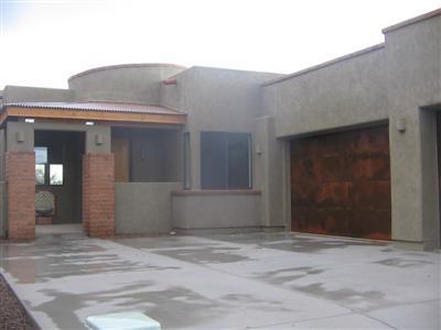 Beautiful views of the Catalinas and city lights from this upgraded home in gated Sky Ranch. Granite counters w/rollout shelving, 18 ceramic tile, pre-wire for surround sound, ceiling fans, fireplace