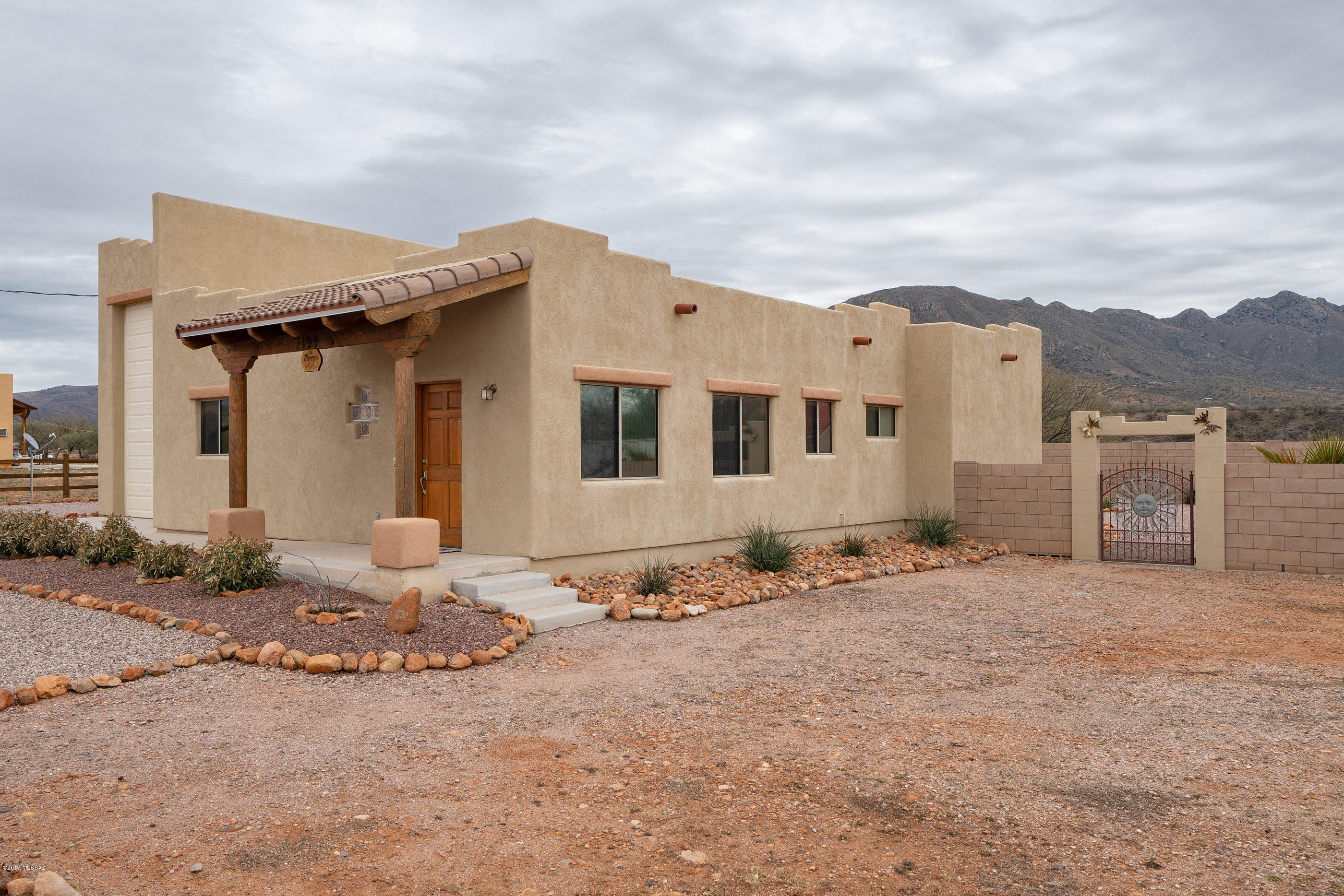 Efficient living in this 1402 SF home with 2bedrooms & 2 baths.  Home is being sold  furnished (with the exception of personal & sentimental items) so you can move right in and enjoy the panoramic views from the impeccably maintained 1/2 acre lot with RV garage and full hook-ups!  RV garage is 40'' long, door is 12' wide, 14' tall and the ceiling hight inside is 16'. Don't delay - call today!