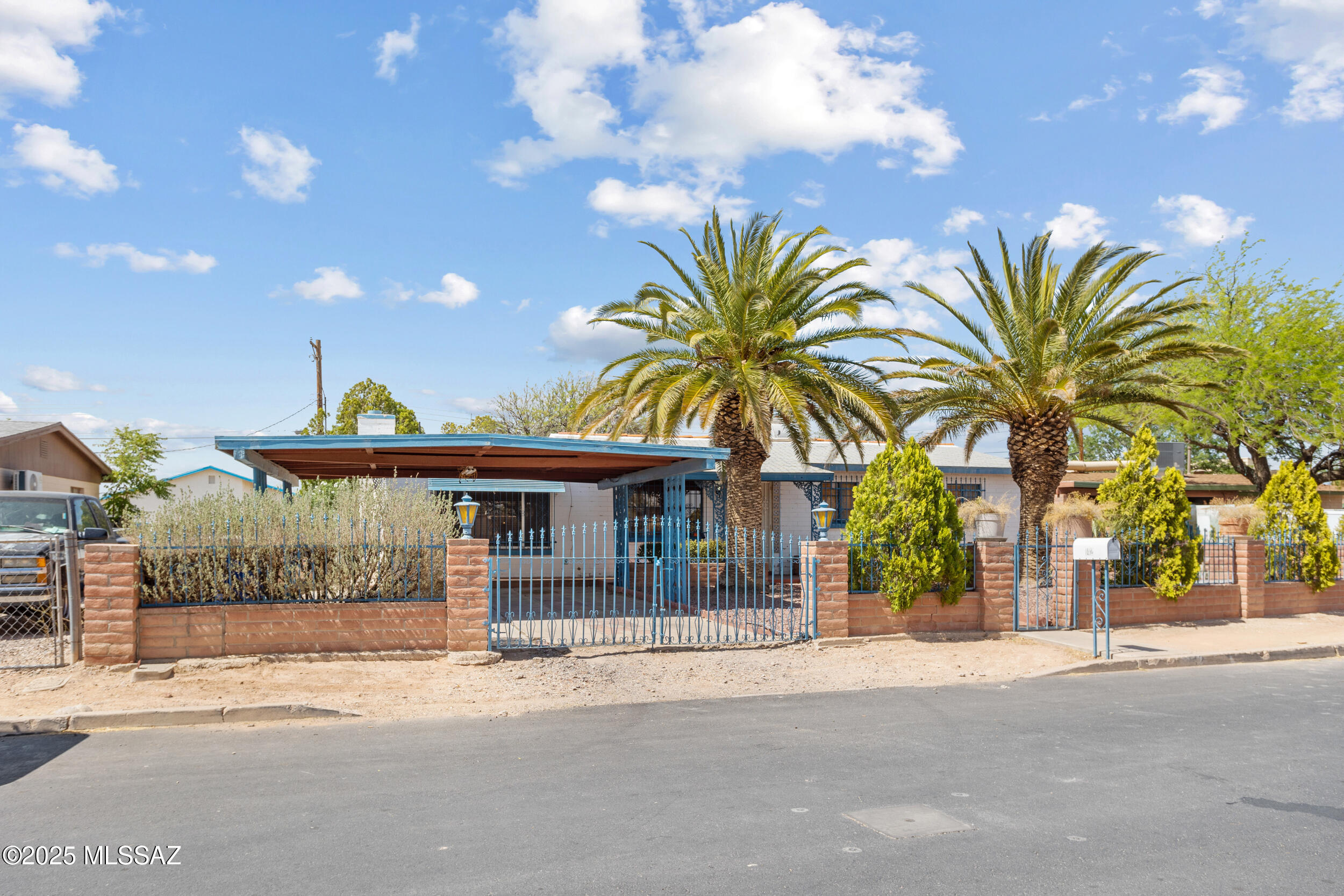 ****FIXER-UPPER**** Price improvement reflects the home's potential for future customization or improvement. Spacious 4-Bedroom Home with Huge Potential - No HOA! Welcome to 142 W Borrego St, a 4-bedroom, 2-bath home with over 2,000 sq ft of space located in a quiet South Tucson neighborhood. This home features a functional layout with generously sized bedrooms and a large living area perfect for gatherings. The backyard offers endless possibilities for outdoor living, gardening, or adding personal touches.  While the property needs some TLC, it offers a great opportunity for buyers to bring their vision and make it their own. Additional highlights include a gated covered carport and 2 sheds. With no HOA, this property is ideal for homeowners seeking flexibility and freedom. Conveniently located near schools, parks, and shopping centers, with easy access to I-10.
