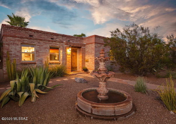 Rustic meets modern in this classic, lovingly updated Sam Hughes Territorial. Warm wood ceilings, natural light & modern upgrades create an inviting & soothing ambiance. Open floor plan takes advantage of the natural light & highlights the serene, backyard with lush green ''faux'' lawn, sparkling pool & outdoor entertaining area. New Kitchen features Cambria Quartz counters, custom cabinets & stainless appliances. Split floor plan: Master Suite features en-suite bath w/ walk-in shower, 2 walk-in closets and a stacked washer/dryer. East side of home features 2 nice sized bedrooms + bath with tub/shower combo. Bonus room by the pool can be home office, fitness/yoga/flex space. NEW HVAC unit & pool pump, roof just coated. Walk or bike to UA, restaurants, coffee and more. Jump on this one!