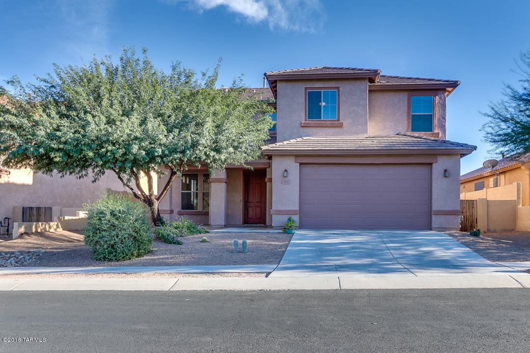 This is a beautiful 2940 Sq.’ 5 bedroom/ 3.5 bath home located on a large lot in the gated community of Entrada Bonita; part of the Award-Winning Master Plan community of Rancho Sahuarita.  You will love the attractive earth tone tile floor and warm neutral paint color.  The well-appointed gourmet kitchen offers striking maple cabinets, granite countertops, large island and stainless appliances including gas cook top and double ovens.  The cozy room off the front entry, downstairs half bath and upstairs loft area make this home very functional.  The oversized backyard is complete with extensive paver patios, lush artificial grass and fire pit.  The home also has an extended 3 Car Garage and quaint neighborhood park across the street.  This spacious gem is a must see!