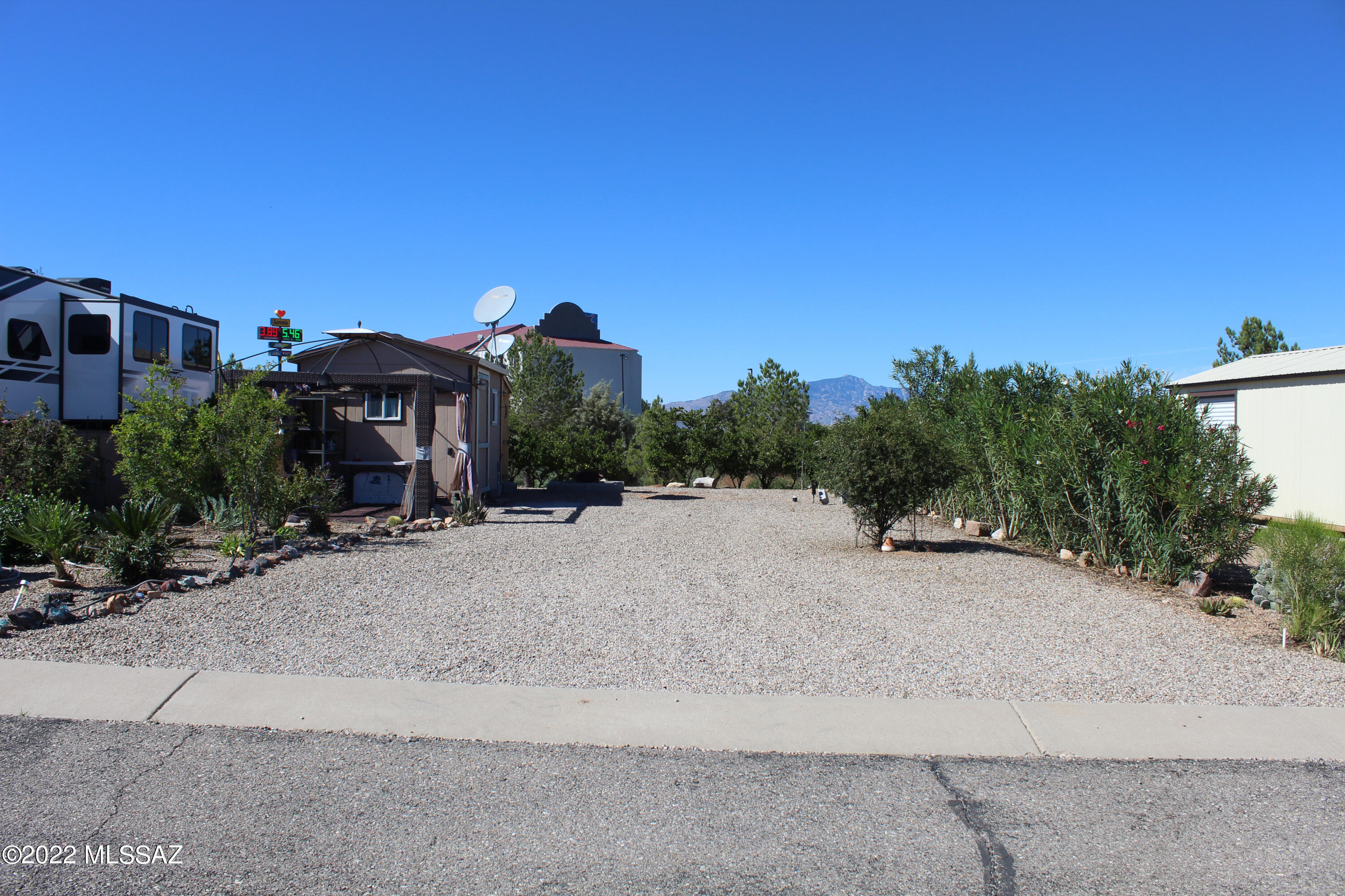The finest relaxation available at a premier 55+ Arizona RV Resort. Mountain views and convenient amenities. Includes a 10'x12' shed and 4'x8' 1/2 bath connected to water. Relaxing gazebo and easy to maintain landscaping with drip irrigation. Shed has been plumbed for washer and dryer.

Monthly dues of $60 include water, sewer, and trash pickup. Large, updated clubhouse offers an exercise room, pool room, meeting hall, laundry, and more convenience. Attached to the clubhouse is a sparkling pool and hot tub to relax. Motivated Seller! Come see for yourself!