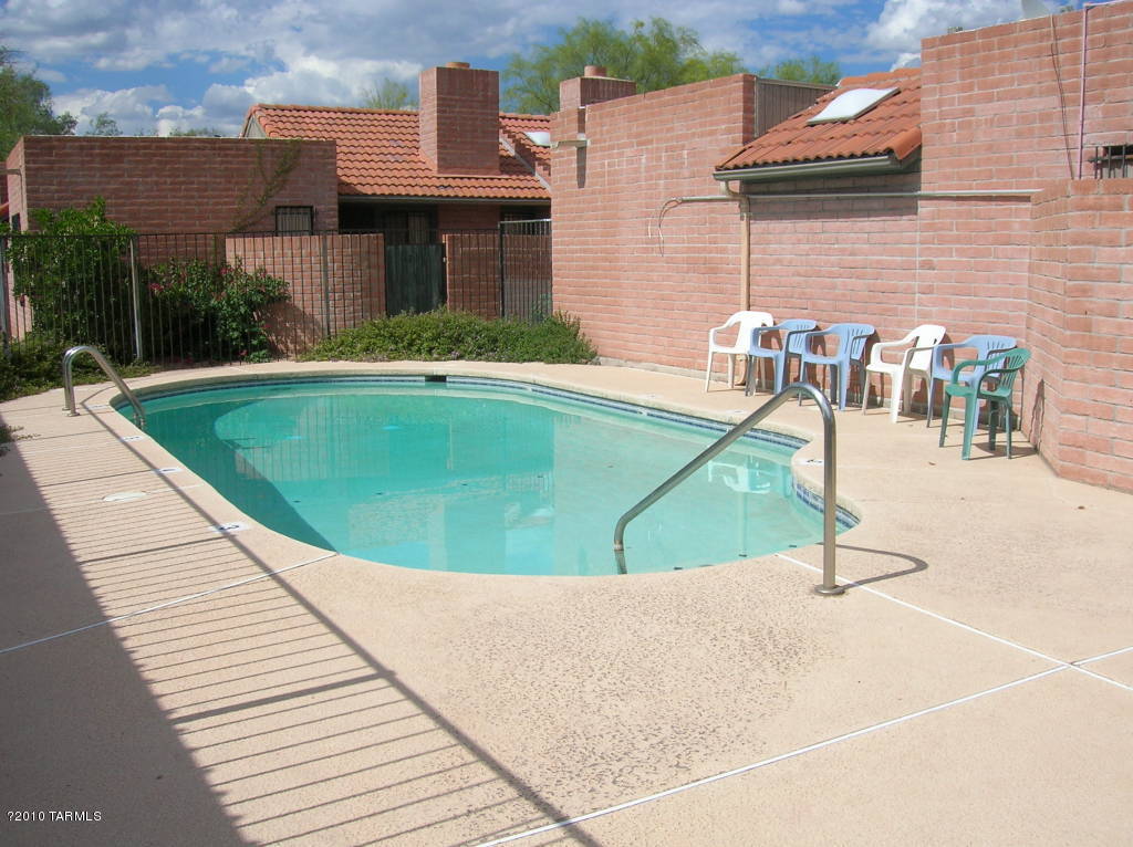 Totally remodeled before last tenant move in, look great!! New paint, carpet, vinyl, and much more. Sweet Town Home with 2 bedrooms and 2 baths in an extremely quiet neighborhood with a terrific community pool about 100 feet from your door. Small enclosed front patio  and super location. Location is out of this world with just about everything you can dream of within walking distance. Restaurant Row is even 3 blocks away. And you get covered parking. Washer and dryer maintained by tenant.