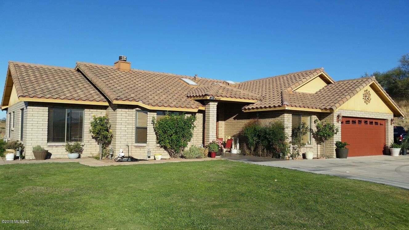 Hillside get away!  Beautiful home with never ending views!  4 bedroom 2.5 bathroom home with formal dining room, tile floors, large master suite, and see through fireplace in living room.  Back yard oasis with pool, grass, extended covered patio, water feature, and room for RV's.  Come see this wonderful home!  Your buyers won't want to leave!