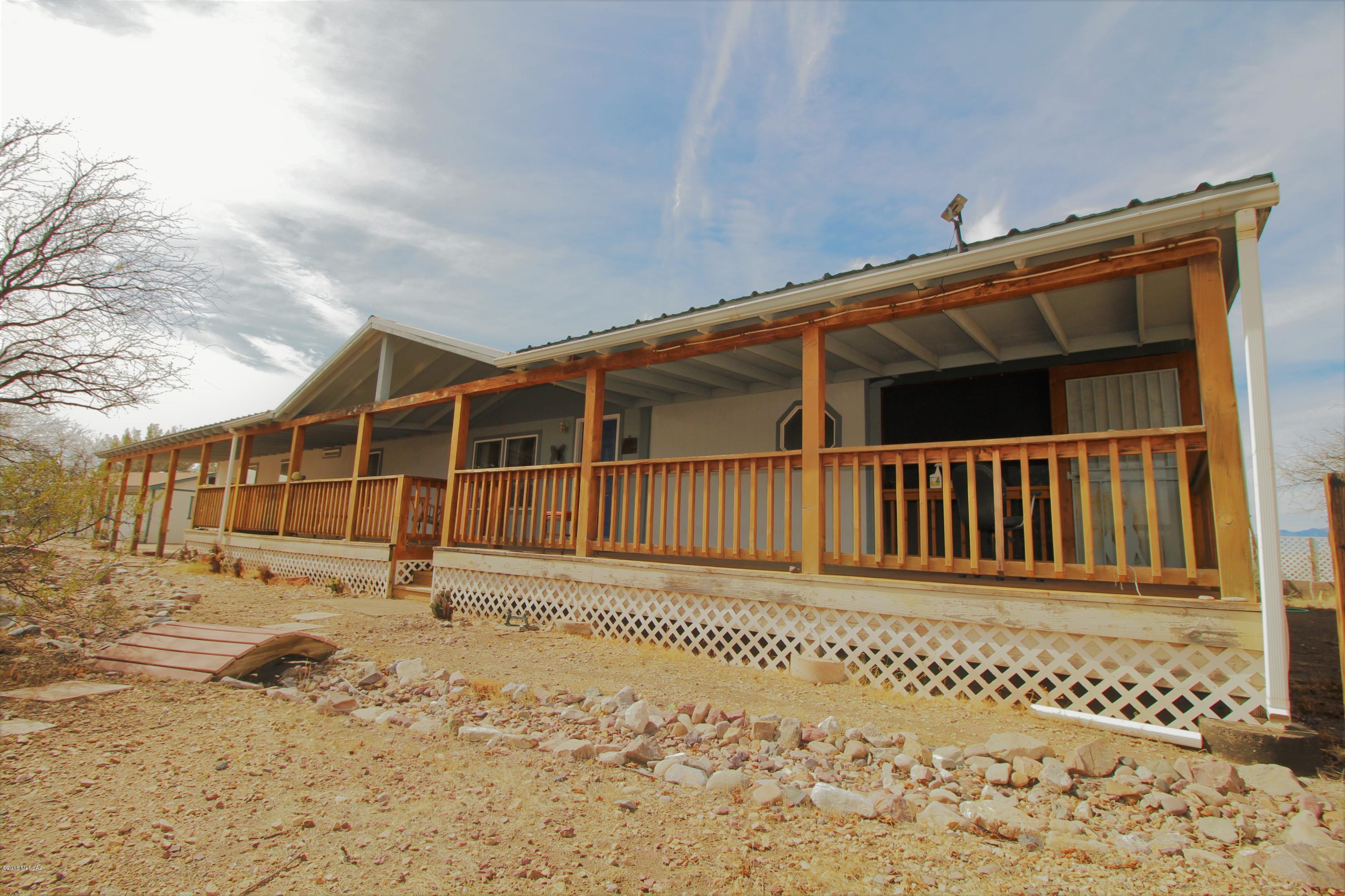 YOU FOUND YOUR HOME. Fantastic rural home, over 3 acres, huge porch, perfect for enjoying an early evening outdoors.  This spacious 4 bedroom home has the room you are looking for. Great condition - Ready for you today. Separate building for workshop with Electric.