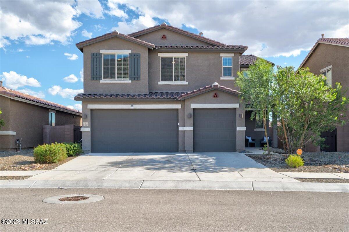 This spacious 5-bedroom, 3-bathroom home with a 3-car garage and NO CARPET is a perfect blend of comfort and convenience. With a generous layout, modern amenities, and a convenient location, it's the ideal family retreat. The open-concept design of this home creates a welcoming atmosphere, great for entertaining guests or spending quality time with family. Kitchen is equipped with SS appliances, ample cabinet space, and a large island, making meal preparation a breeze. Step outside to your private backyard retreat finished with turf and pavers. This home is conveniently located near Tucson Spectrum providing easy access to shopping, dining, schools, parks, and major transportation routes. This home offers everything your family needs. Contact us today to make it yours!