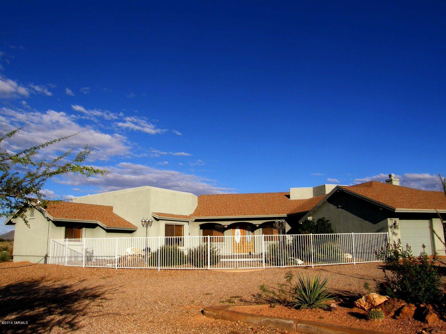 REDUCED TO $380,000!! Spacious home with a guest house on 36+ acres nestled in the foothills of the Dragon Mountains. Spectacular mountain views in all directions. The courtyard entry leads into the great room where you can enjoy the incredible mountain views. Open floor plan with a wet bar, formal dining & sitting area with  fireplace. The well designed kitchen offrs a top line appliances. Breakfast area & den with a fireplace off the kitchen plus 2 pantrys & a laundry room with sink. The home has 2 patios, pool & a guest house. Great for horse & nature lovers with so many wonderful places to ride & hike. Come enjoy spectacular sunsets, dark starry nights & a mild year around climate. Less than an hour to Tucson & Sierra Vista. More info call broker living in Dragoon Mountain Ranc