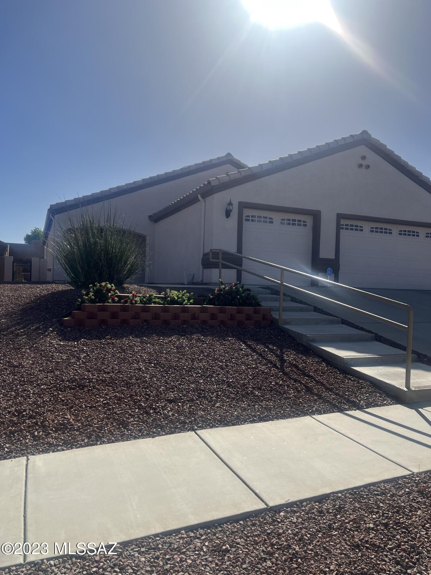 This house has a lot of WOW features! It's been immaculately cared for and is as beautiful inside as it is outside.  HVAC new in 2020 with a pre-paid transferable service agreement.  Water heater new in 2021.  Washer/dryer new in 2020.  New garbage disposal 12/22.  Privacy screens in both front bdrm windows, plantation shutters, built-in wall shelves and corner bee hive gas FP in the great room.  Ceiling fans throughout. 
Enjoy lounging on the private patio surrounded by beautiful desert foliage.  The pergola patio roof is aluminum and weather resistant.  Completely move in ready.  Won't last long so call me for a showing today.
