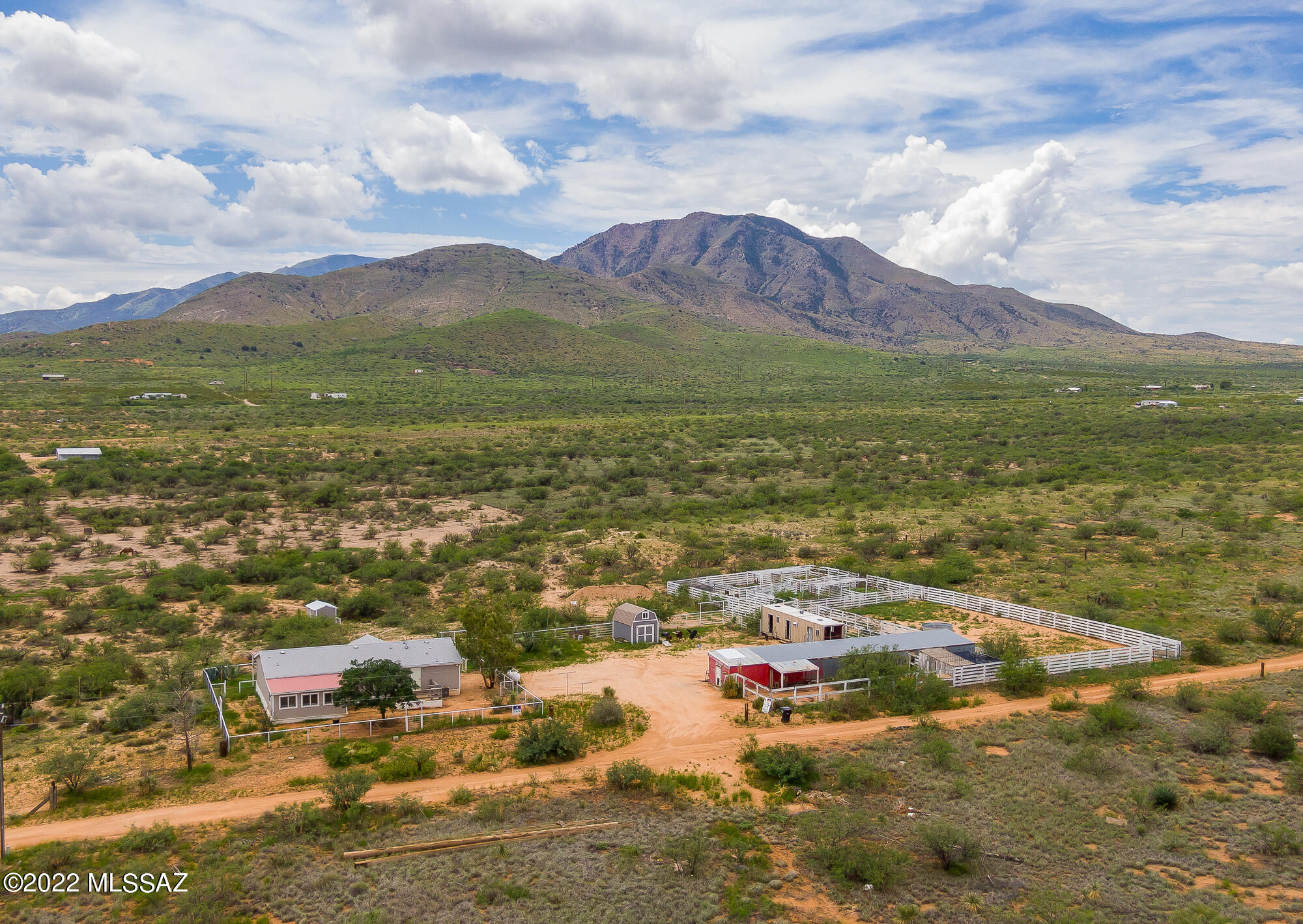 Seller will accept or counter offers within the range of $279,900-299,900. Peace, privacy, and tranquility await you. Centrally located between Benson and Willcox, this 4BD/2BA plus den is nestled on 17 acres with panoramic mountain views. Split bedroom floorplan, large great room, over sized den, as well as a large kitchen with tons of cabinet, storage, and counter space is simply waiting for you to add your personal touch. Front deck is fully covered so one can enjoy the stunning views and still have plenty of room to entertain or simply enjoy the quietness. Property features its own PRIVATE well, multiple corrals, steel livestock working facility, poultry facilities, and an arena. Located a half mile off of Dragoon Rd, and minutes from I-10, come enjoy all this property has to offer.