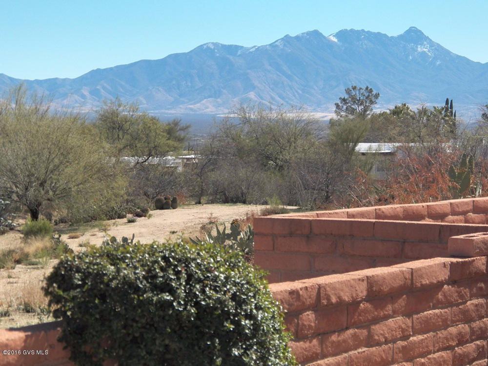 Not often do you find such a charming, fully furnished 2BR 2BA townhome with amazing panoramic views for less than $100,000. Grab it now! A recent addition brings the total heated/cooled sq footage to 1187. The ever changing mountain vistas and desert wildlife, so vibrant from this east facing rear patio, are primary reasons why our winter residents love Green Valley. The interior reflects the Southwest in its recently painted interior where popcorn ceilings have been removed. Nearby community clubhouse and pool. Membership to Green Valley Recreation is optional.
