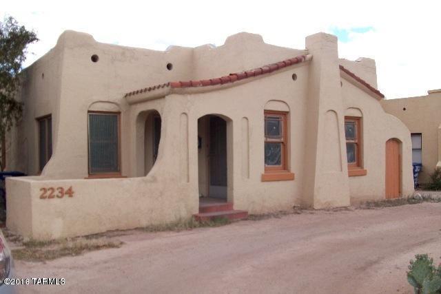 Close to UA!,Historic Sam Hughes, Santa Fe-styl,e 2/1 w/basement, large main bedroom, wrap-around wood deck in back and covered porch in front, hardwood floors throughout, skylights, dining room, DW, evaporative cooling, electric heat, W/D, alarm system for your activation FP not wood burning or gas. Decorative, great for candles. Off-street parking, approx 1200 sq ft.