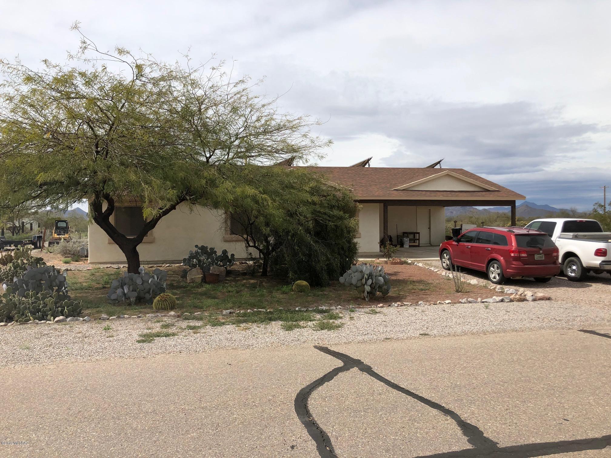 Well maintained home with lots of extras. Solar panels owned, not leased help keep the electric bills low year round. Brand new 15 sear high efficiency A/C unit. New high efficiency tank-less water heater! Full RV hookups, and parking space next to the home. Beautiful kitchen cabinets and counter tops. Open spacious living room just off the kitchen great for entertaining. Four good sized bedrooms and closets. Large backyard fenced, with no neighbors to the west, just beautiful unobstructed sunset views!