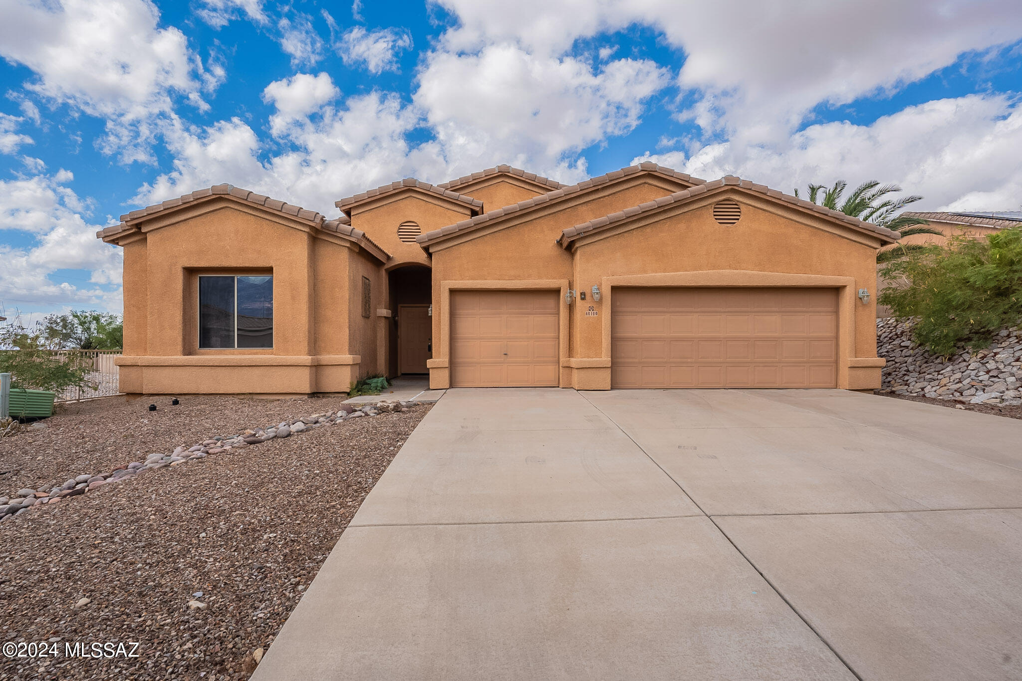 With a quiet and private location on a cul-de-sac in a charming neighborhood of well-maintained homes, this recently updated and very attractive Eagle Crest home provided a retreat from the tumult of city living for the present owners. The neighborhood is safe and welcoming, with gracious neighbors. Hiking, mountain biking and dirt-bike trails are nearby, as are shopping and enjoyable restaurants. The home enjoys bountiful natural light, mountain views and generously sized rooms. A spacious entry foyer greets guests and opens to a very ample great room with a cozy gas fireplace. The adjacent well-appointed kitchen provides generous storage including pull-outs in cabinets, handsome granite counters for plentiful workspace, a built-in desk and breakfast counter. A breakfast room enjoys natural light and overlooks the enclosed rear yard offering fruit trees and a broad covered patio. With a split floor plan, two bedrooms share a hallway bath, with a den/office space nearby. The Owners' Suite is also generously sized, easily accommodating a king bed and sitting area. The Owner's Bath includes a glass-front walk-in large shower, soaking tub, separate WC and bountifully sized closet. A laundry room provides storage cabinetry, work counter and a drying area. The 3-car garage has lots of room for storage. This home, with fresh interior paint and new carpeting, is sparkly-clean and move-in ready.