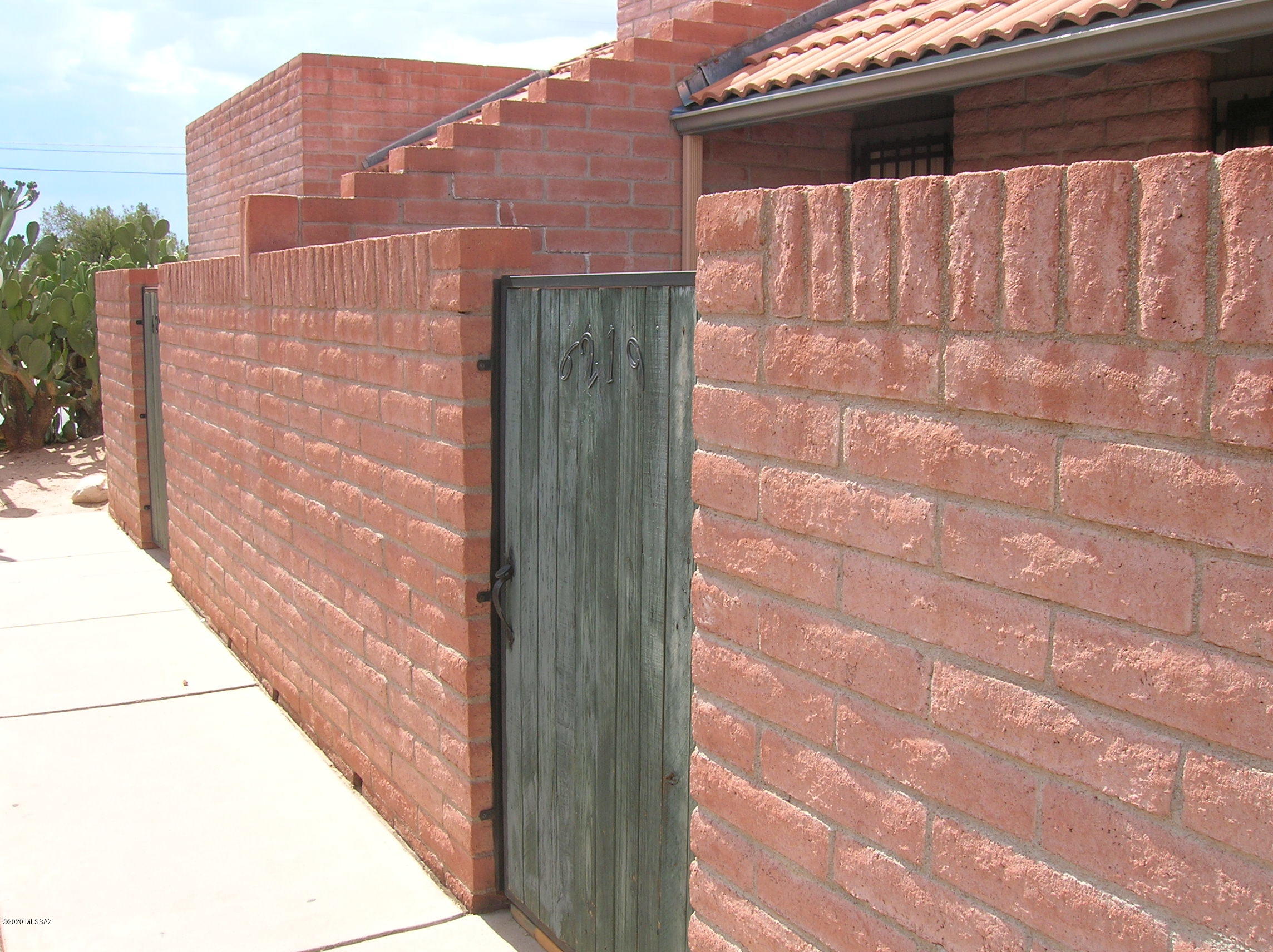 Sweet Townhome / Condo with 2 bedrooms, 2 baths in very small subdivision and extremely quiet neighborhood. There is a community pool about 100 feet from your front door across parking lot to the east. Small enclosed blocked in patio. In Real Estate we always talk about Location, Location, Location. Location is amazing with just about everything you can dream of within walking distance. Restaurant Row is only 2 to 3 blocks away with many, many restaurants. 2 carport parking spaces. Carpet, vinyl, paint, is 3 to 4 years old. Appliances ''AS IS''. Property has been a rental since 2010 and for this reason there will be no SPDS with contract / transaction.