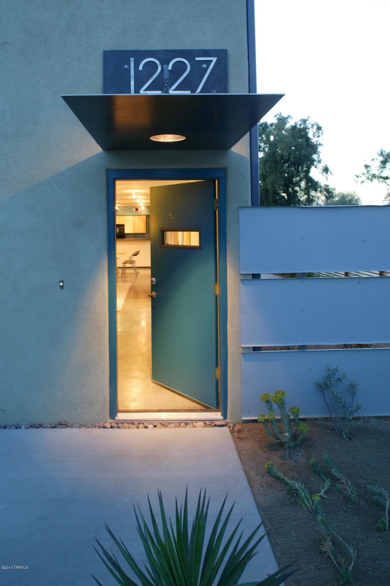 Known as The Slice, is this duplex that was built in 2005. Desirable modern design. Situated within a mile of downtown, the University & I-10. The 2 units are identical with 3BR/3BA each. The lower level offers a completely open floor plan. The kitchens overlook the spacious living areas, have large islands, gas stoves and an abundance of cabinet space. Multiple sliders provide great light & access to the private, walled yards. All bedrooms are spacious, have great closet space & are located on the second level, as are 2 baths. The unique design creates the feeling that each unit is a ''single family home'' One unit is entered from 13th Street & the other from Bailey.   A great opportunity to live on side & rent the other. Or enjoy the near zero vacancy rate & lease both out.