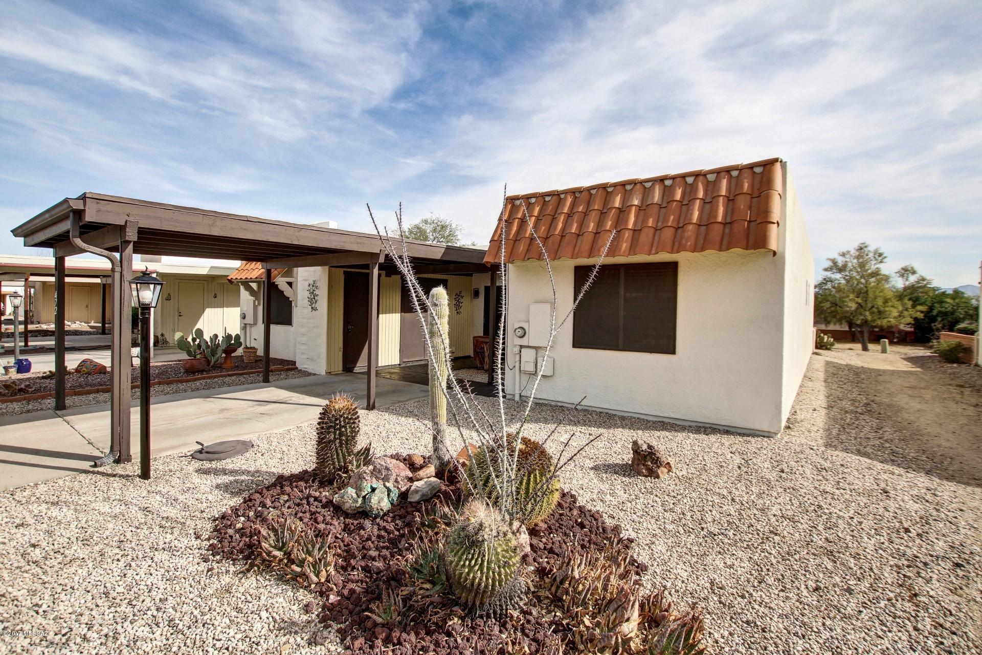 Delightful 2 BD/ 2 BA Townhome Located in the Heart of Casa Paloma 2 Subdivision. This End Unit, with Fresh Interior Paint and New Upgraded Carpet, Offers a Light and Bright Living/Dining Area with Sliding Door to Patio. Kitchen with Breakfast Nook, Updated Counter, New Sink & Faucet, Pantry Closet and Neutral Tile Flooring.  Stylish Barn Door Gives a Modern Touch and Versatility to The Guest Bedroom that Could be Used as Den or Office.   Good Size Master Bedroom with Plenty Closet Space. Walk in Shower and Tile Flooring in Master Bath. New Security Door, Light Fixtures and Solar Screens. Relax and Enjoy the Wonderful AZ Weather in the Inviting  Maintenance Free Backyard, that Faces Common Area with Partial MTN View. Take advantage of all the amenities that the Green Valley Recreation membership offers. Close to Shopping and Easy Access to I-19th. This Is A Must See.!