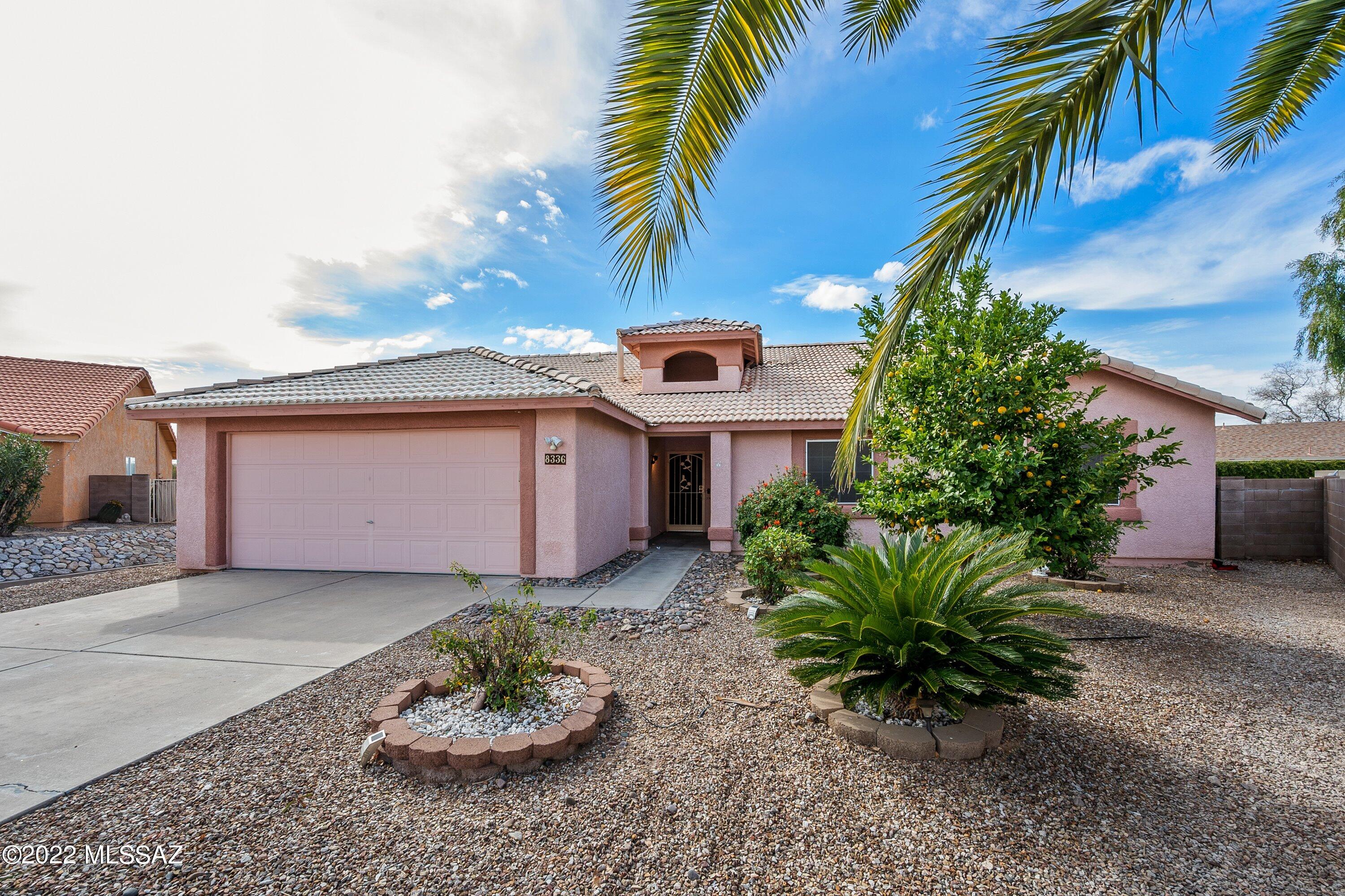Spacious open floor plan in sought after Vail School District. 3 bedrooms plus a den in this popular Rita Ranch home.  Living/Dining room & family room off Kitchen w/vaulted ceilings, ceiling fans & plenty of light!  Kitchen has granite counters, s/s appliances, pantry, breakfast bar & R/O water system.  Beautiful tile floors, bay window in dining & water softener.  Large backyard w/sparkling pool, putting green & no neighbors behind.  Enjoy beautiful sunsets from your personal oasis!  2 car garage with workbench & storage cabinets.  Newer roof, HVAC, 50 gallon hot water heater & drip system.  There is a lot to enjoy in this wonderful home!
