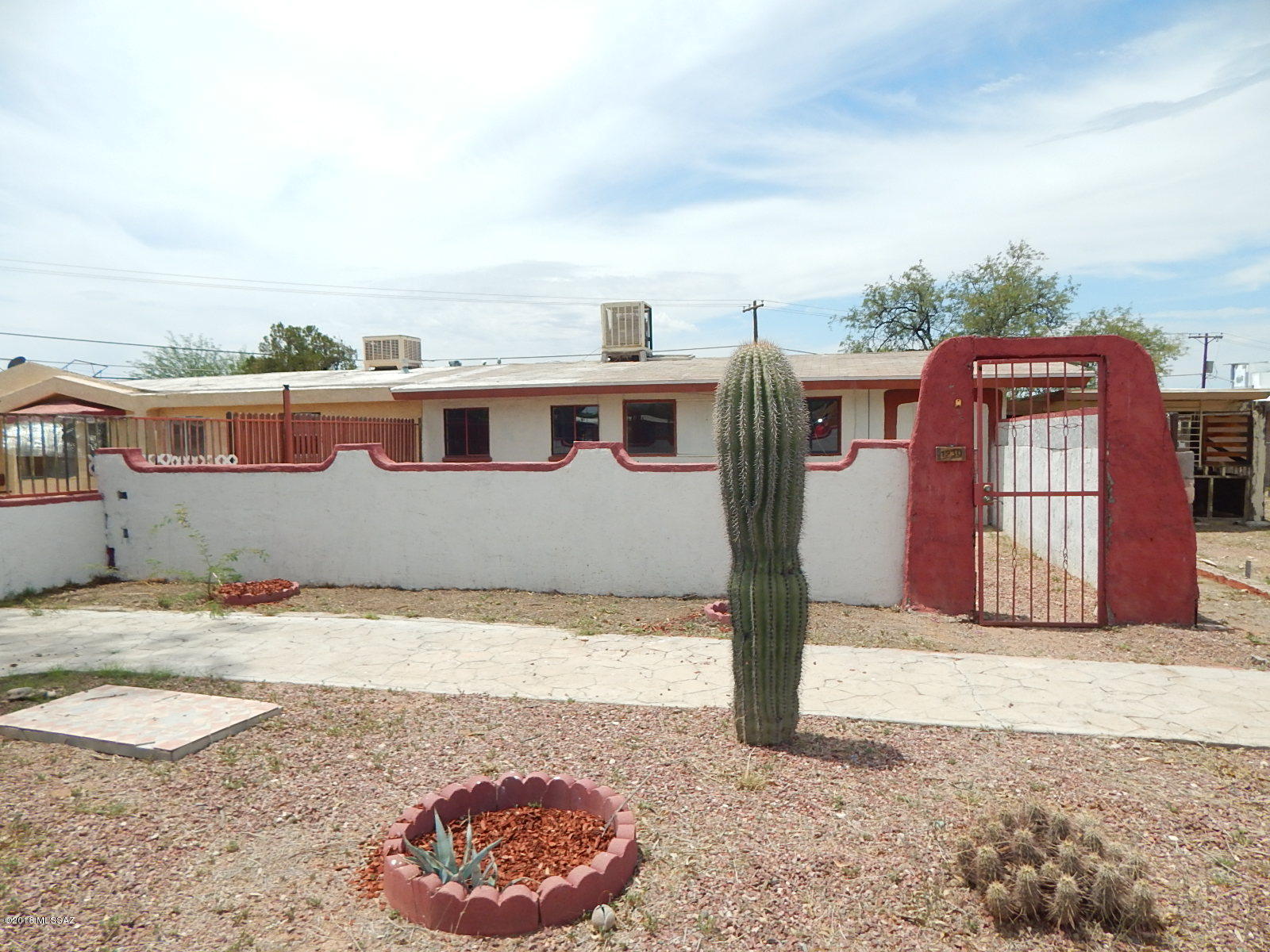 This is a Fannie Mae HomePath property. Investment opportunity for Duplex on large lot. Each unit has separate water and electric meters, separate front and back yards, and fenced back yards for added privacy. Unit #1930 has 2 bedrooms, 2 bathrooms, kitchen with breakfast bar & dining area. Unit #1932 has 2 bedrooms, 1 bathroom & family room with fireplace. NO HOA! Located in South area of Tucson near I-10, restaurants, bus routes, shopping, and much more!