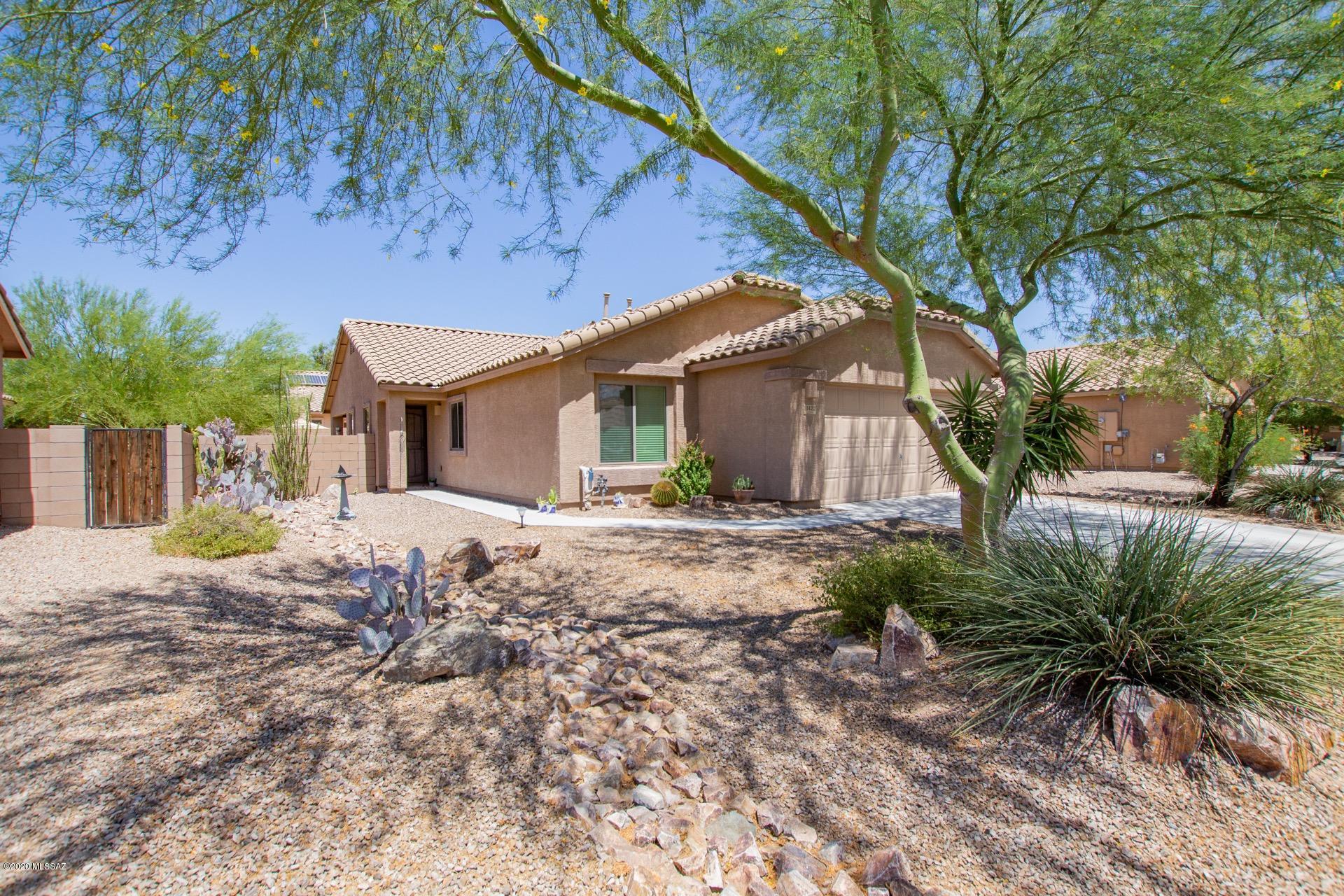 Fantastic 4 bedroom, 2 bath home w/soaring ceilings, welcoming palette, ceiling fans, window blinds, & open floor plan.  Stylish kitchen counters, breakfast bar, pantry, & plenty of wood cabinets. Charming dining area w/upgraded lighting. Generous sized bedrooms, ample closets, & interior laundry closet. Spacious backyard w/a covered patio has plenty of room for a pool! Lovely established neighborhood.