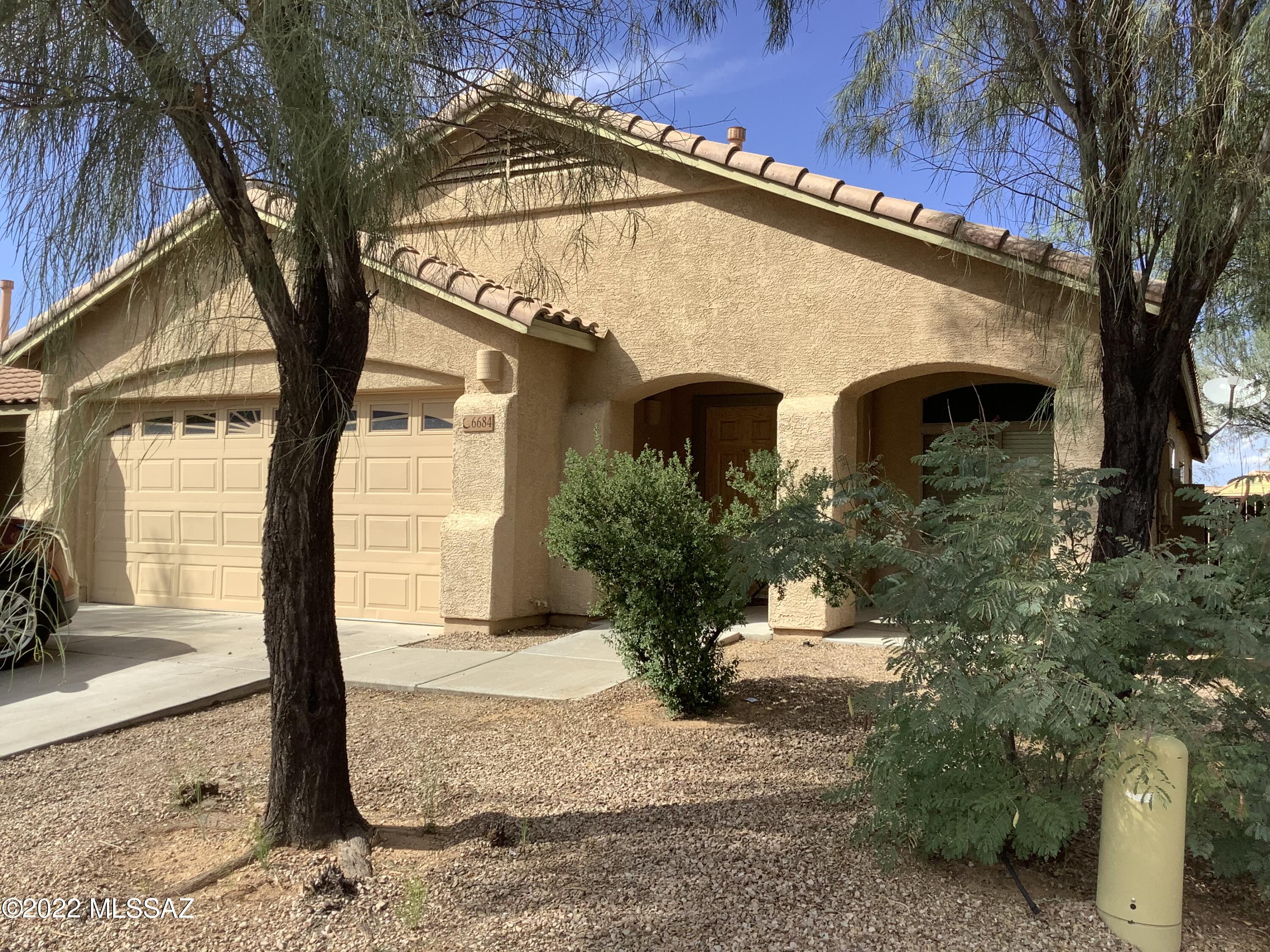 This home is located on a large corner lot with Ceramic tile entry and large living room and formal dining area, kitchen features plenty of cabinets including large pantry, also you will enjoy the gas range, built in microwave, dishwasher and refrigerator with ice and water thru the door. Counter top eating bar with more dining are or den with sliding door to the huge backyard. Carpeting only in the bedrooms here and there are 4 of them! Two of them off the front living area with full bath. Primary bedroom features large closet, bath with soaking tub and double sinks plus an additional bedroom nearby. Community park, walking trails and playground nearby and easy access to the freeway and the Casino!