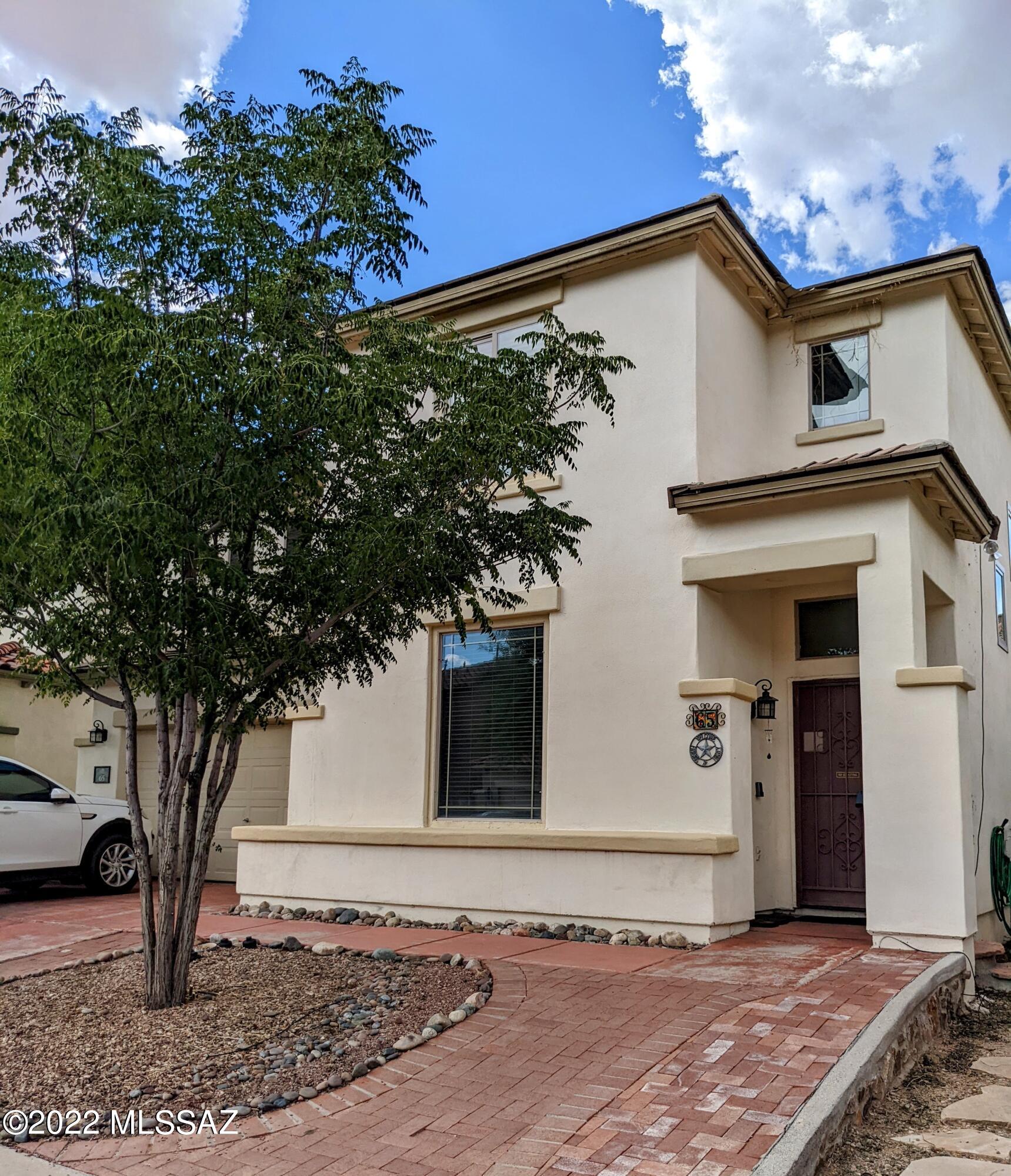 Seller will accept counter offers between $355,000 and $359,000. Beautiful spacious Pulte Home located in the heart of Rancho Sahuarita.  BRAND NEW AC UNIT!!!  NEW Kitchen sink, faucet and disposal!  New diswasher!  Four new windows!! This home boasts lovely wood-like ceramic tile in the entire first floor and a convection oven for great baking.  4 nicely sized bedrooms.  Laundry room offers additional storage.  Owners suite with en-suite bathroom includes two vanities and roomy walk-in closet.  Paved backyard with built-in BBQ is perfect for entertaining.