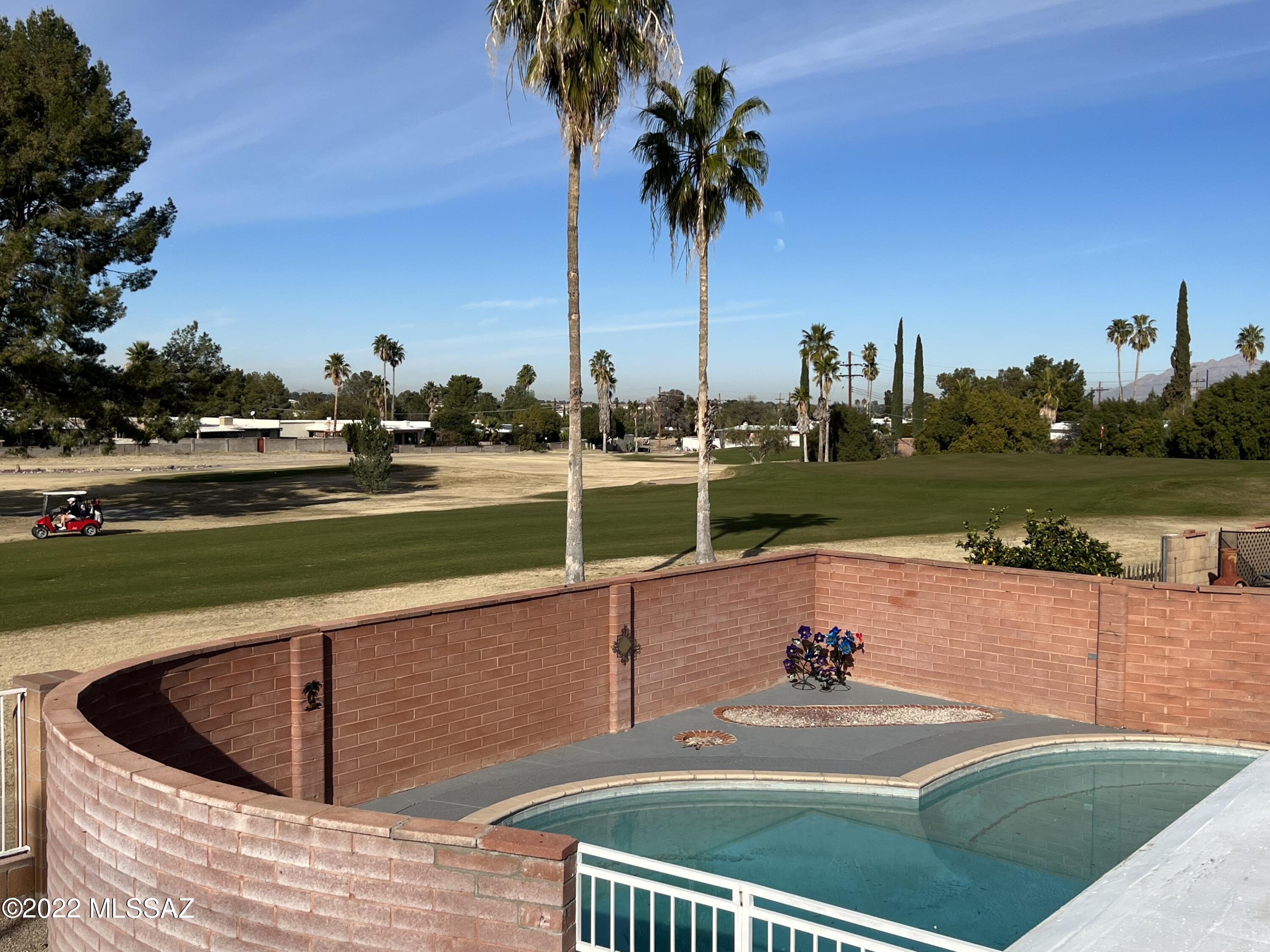 Pool & Golf Course Views! Beautiful 3 bedroom, 2 bathroom updated home located in Rolling Hills! Great room floor plan with separate den/living area. Recently remodeled bathrooms, updated flooring, fireplace and open updated kitchen. Large back yard with pool, covered patio and amazing sunset and golf course views! Conveniently located on Tucson's east side.