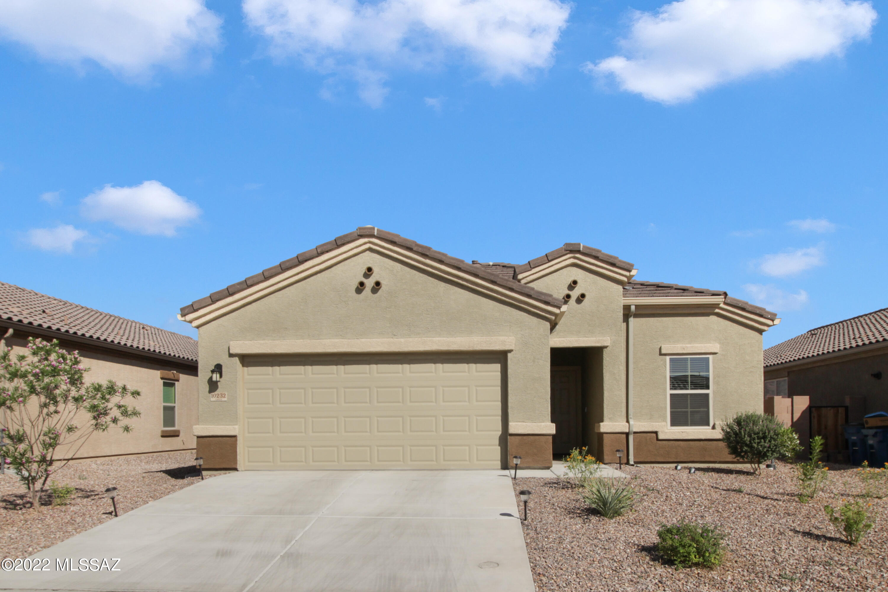 Wonderful opportunity to own a 2020 home in bustling Saguaro Bloom. Community splash pad, multiple pools, community center. Gym facilities. Walking trails, paved street and sidewalks. Basketball court. Ask HOA about planned extensions in the community! Island kitchen. Open floor plan. Tile and carpet throughout. Well cared-for and lovingly upgraded. Backyard includes pavers and easy care turf. Stainless steel kitchen appliances, refrigerator conveys with sale. Reverse Osmosis available at kitchen sink. Laundry room with washer/dryer included. ADT alarm system installed and can be transferred to new homeowner, including window and door sensors and video doorbell. Tankless hot water heater. Buyer to verify all facts+figures, including those in MLS.