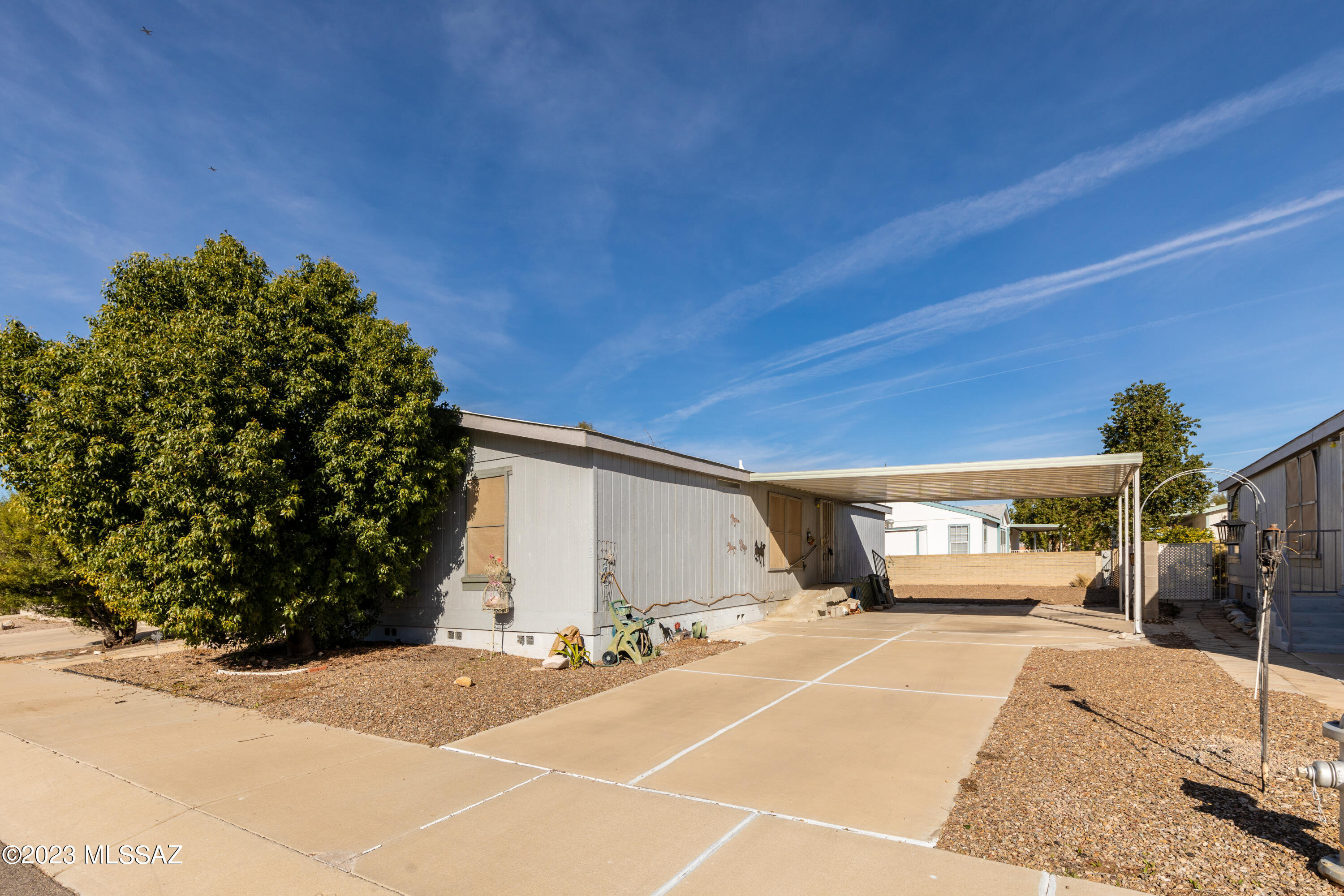 Fantastic location! Just minutes from shopping, restaurants, and Northwest Medical Center. Nestled in a little gated community, this home offers a split floor plan with 3 bedrooms and 2 baths. Nice sized backyard and an attached carport. New HVAC in 2019. All appliances included. Low HOA fees. Move-in ready or update to your liking! Great opportunity as homes do not become available in this community often!