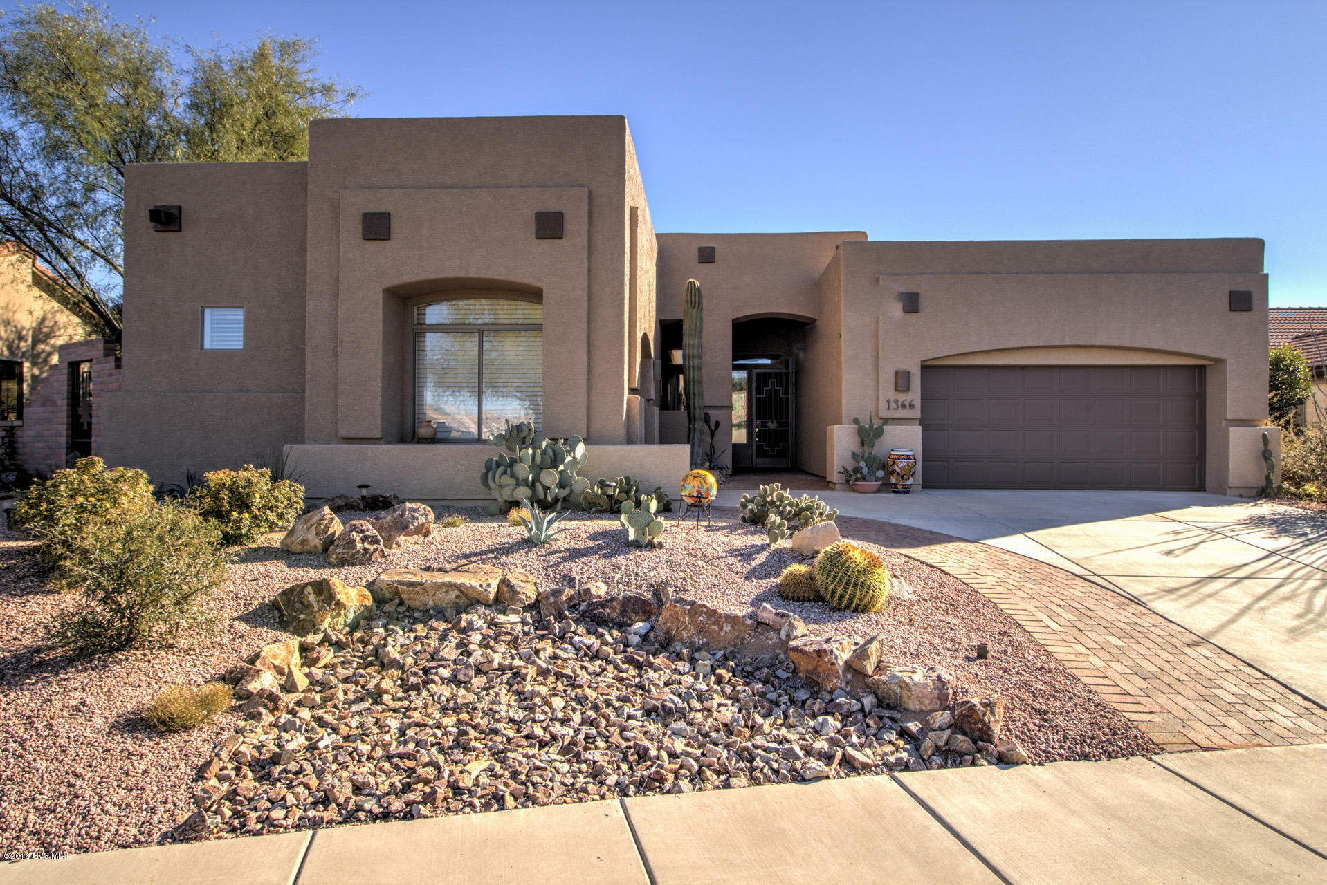 Seller has reduced the price $29,000! INCREDIBLE VALUE! Don't miss the opportunity to own this gorgeous Santa Fe style home with stunning views of the Santa Rita mountains, golf course and desert landscape.Located on the 6th Fairway of the Quail Course and just a few blocks to the club house, restaurant, fitness center, pools, tennis and bocci courts, the new arts and technology center and all of the other amenities that this sought after Robson Community offers.
 Perfect for indoor and outdoor entertaining, this home features a gourmet kitchen with travertine counter tops,a custom granite island, a built- in gas fire pit & barbecue. Other features include a spacious master suite with walk-in closet, separate shower and soaking tub, executive height double sinks and more.