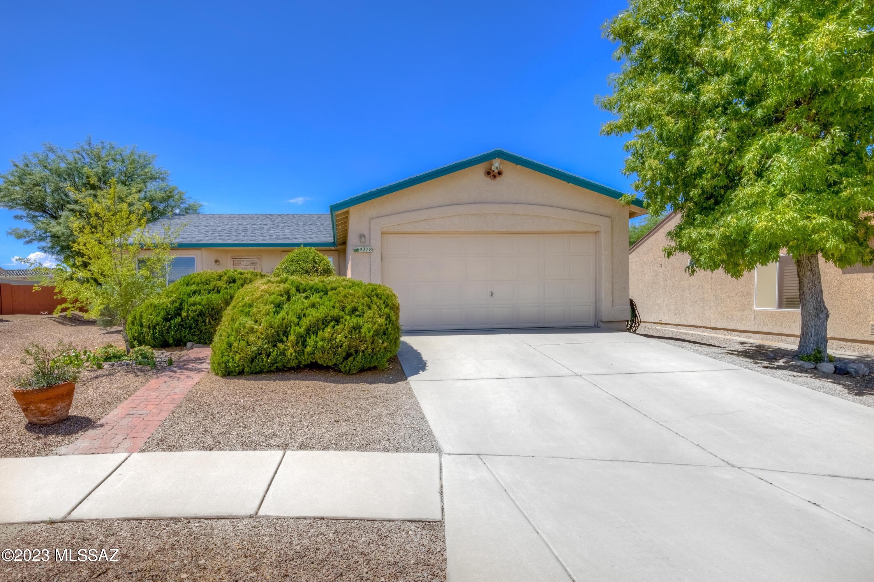 This is your WOW!  This lot at the end of a cul-du-sac boasts a very spacious backyard, enjoy desert nights outside in your hot tub or watching TV, or tending to the plants in your greenhouse.  Inside this updated kitchen will delight you, the homeowner also built an addition, which was permitted, to add office space. Spacious owners suite. Lovingly cared for and maintained, this is it!  Close to Saguaro Park East, retail and restaurants.  A true desert delight.