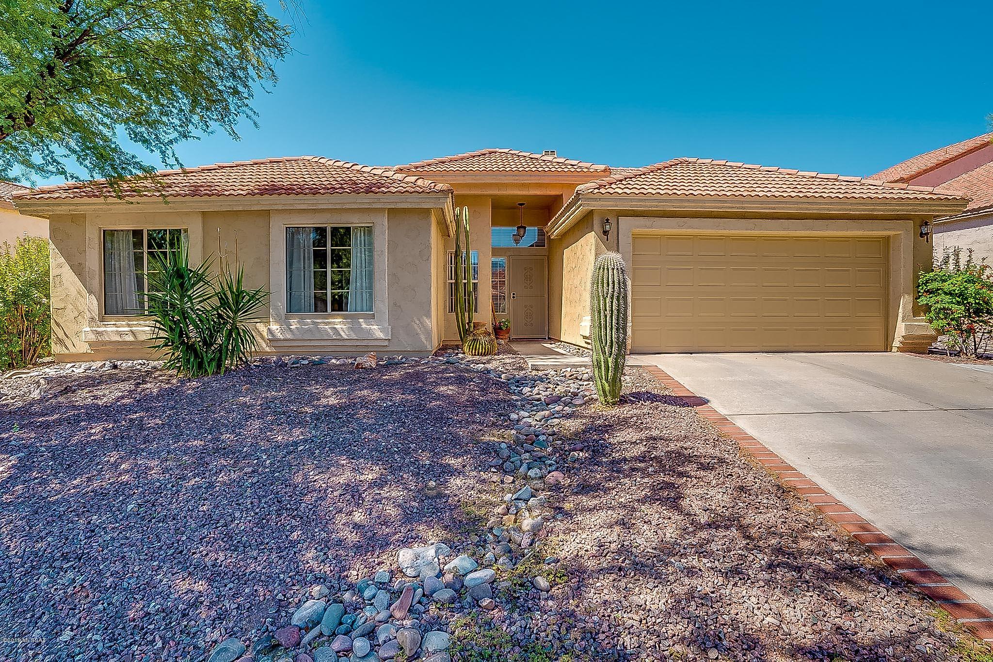 Beautifully updated, meticulously maintained one story 4bd/2bth home in highly sought after Copper Creek. Your kitchen features updated cabinets, countertop, tile flooring, backsplash and stainless appliances. Master boasts a remodeled bath with rich cabinetry/fixtures, granite counters, soaking tub & rainfall shower. Even the guest bath has been beautifully updated! Relax in the quiet, private landscaped backyard with mature fruit trees. Walking distance to Copper Creek elementary and minutes from Oro Valley community center, pool & golf course, hospital, & shopping. All the work has been done ... just move right in!