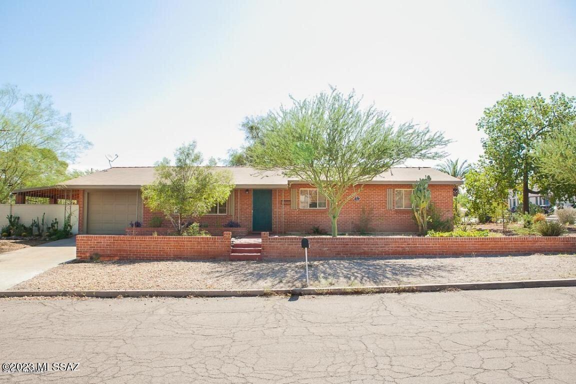 This charming, historic home from the 1950's is located in the  Blenman-Elm  neighborhood that is built with double brick construction and sited on a corner lot.  It features an open floor plan with bright kitchen, tile flooring,  two full bathrooms and 1 car attached garage with  separate storage closet.   Travertine stone  highlights guest bathroom that includes a jetted tub & primary bathroom with shower.  The home also boasts kitchen with  stainless steel appliances, gas range, refrigerator, dishwasher and patio off kitchen to enjoy your morning coffee and views of the mountains.  Close proximity to restaurants, shopping, Banner UMC, U of A and the Arizona Inn make this an incredible investment opportunity or your primary home.